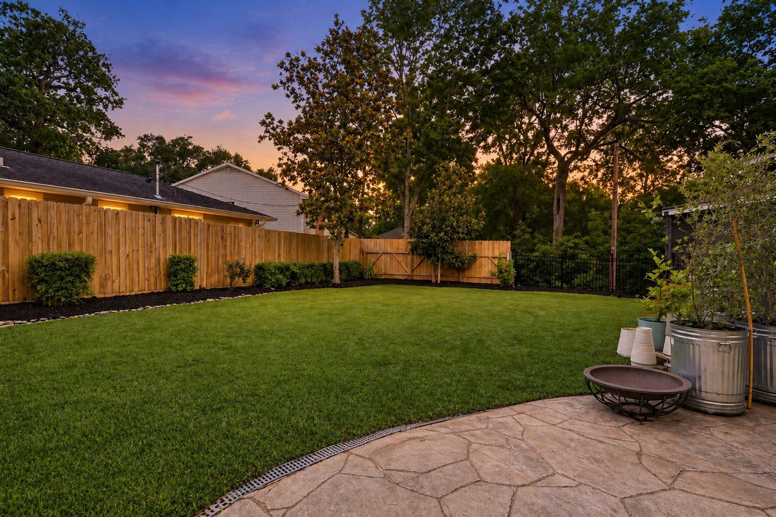 12574 Westerley Lane, Houston, TX 77077 A sweeping lawn, mature trees, and a curved patio create an inviting backyard setting for outdoor dining, play, and relaxed evenings.
