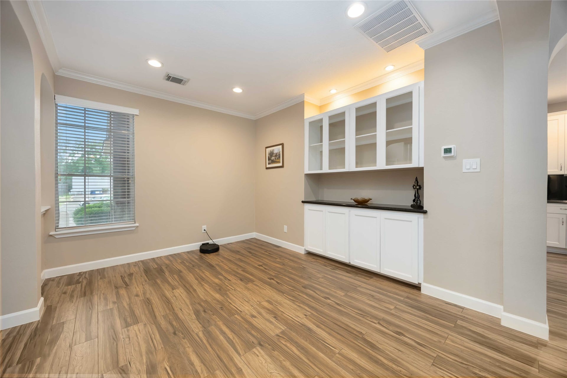 5498 Appleblossom Lane, Friendswood, TX 77546 The formal dining room features a custom built in for added storage.