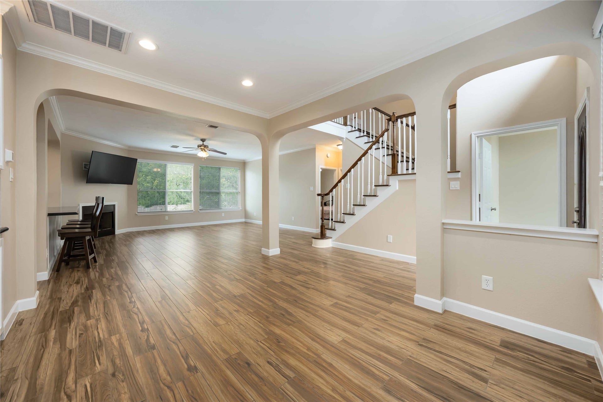 5498 Appleblossom Lane, Friendswood, TX 77546 This is a view from the dining room looking into the spacious living room. To the left you will see the breakfast bar that makes the kitchen open to the living room. Making this a great entertaining area.