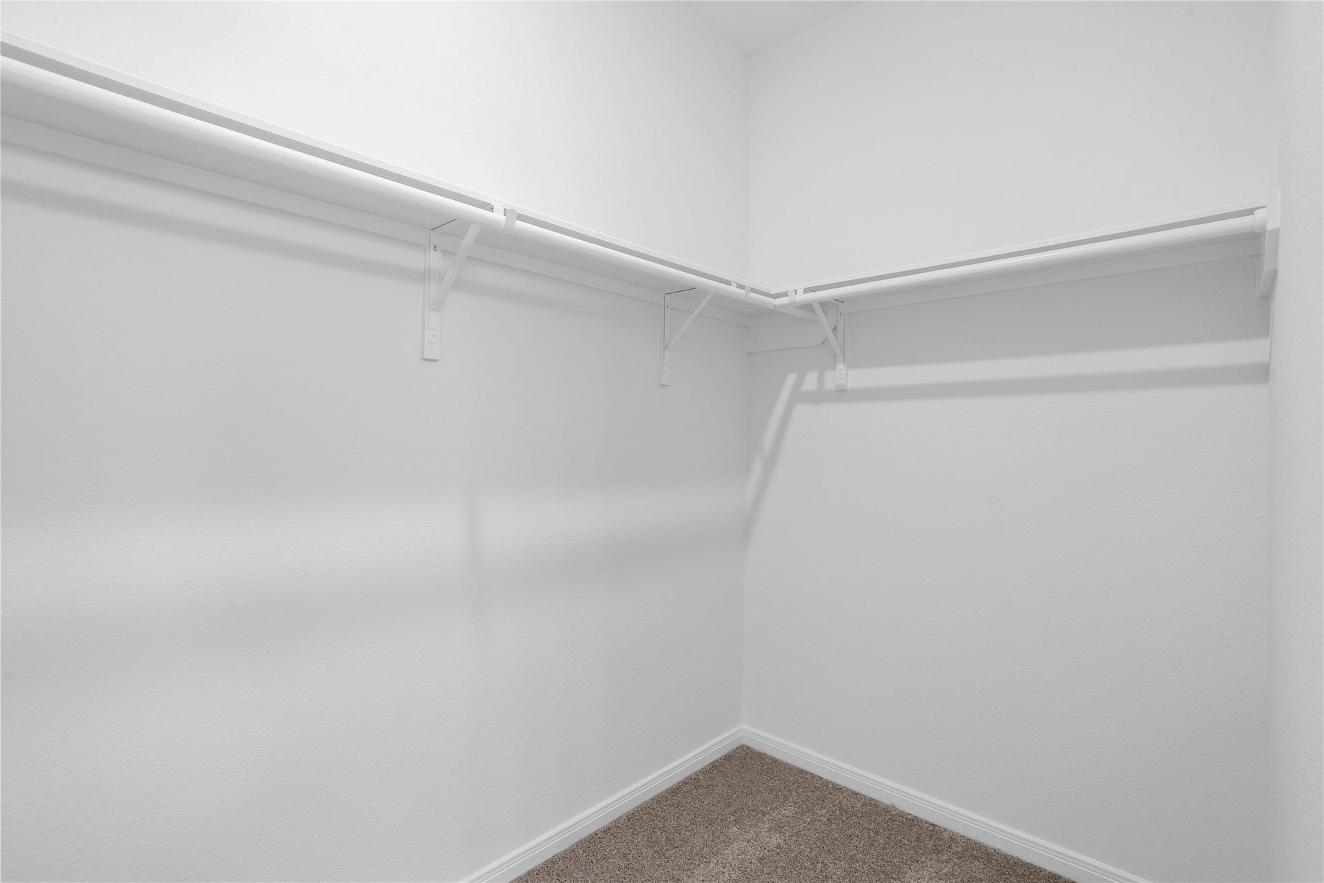5619 Blackbird Lane, Hitchcock, TX 77563 Spacious primary walk-in closet featuring functional built-in shelving and ample hanging space.