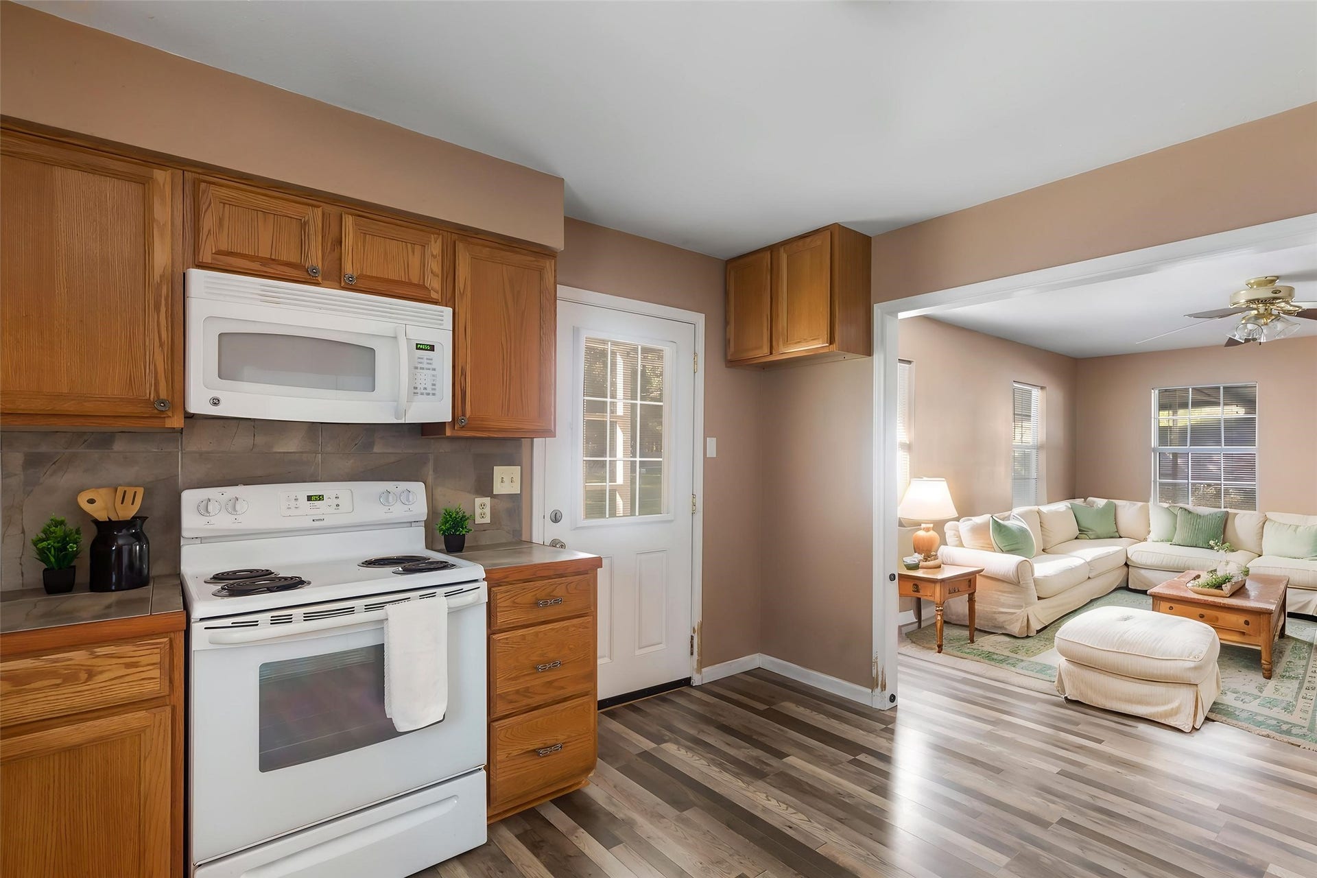 23304 E Community Drive, New Caney, TX 77357 Convenient kitchen layout with easy access to the living area and exterior door. (This photo is virtually staged.)