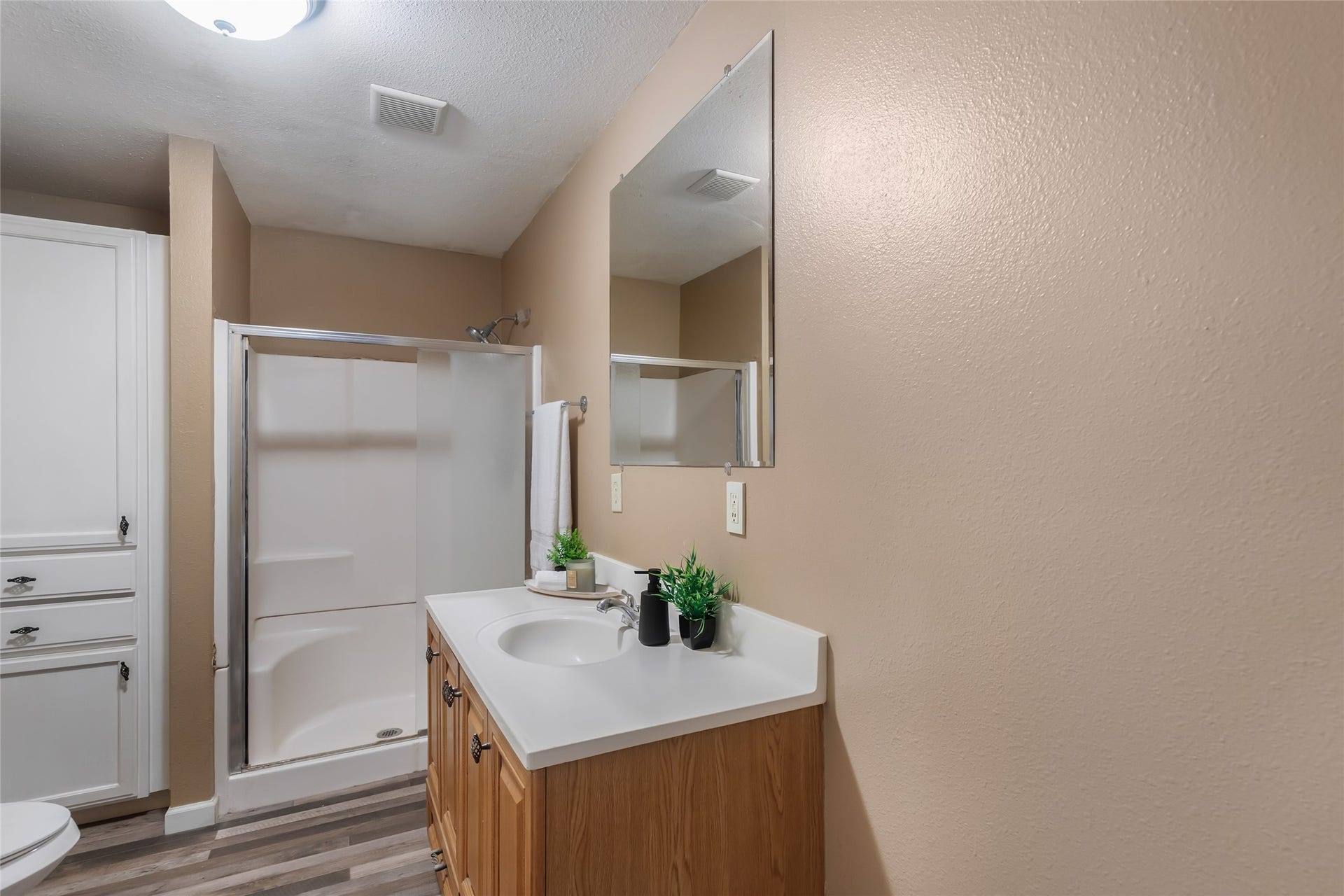 23304 E Community Drive, New Caney, TX 77357 Full bathroom with vanity, ample storage and walk-in shower.