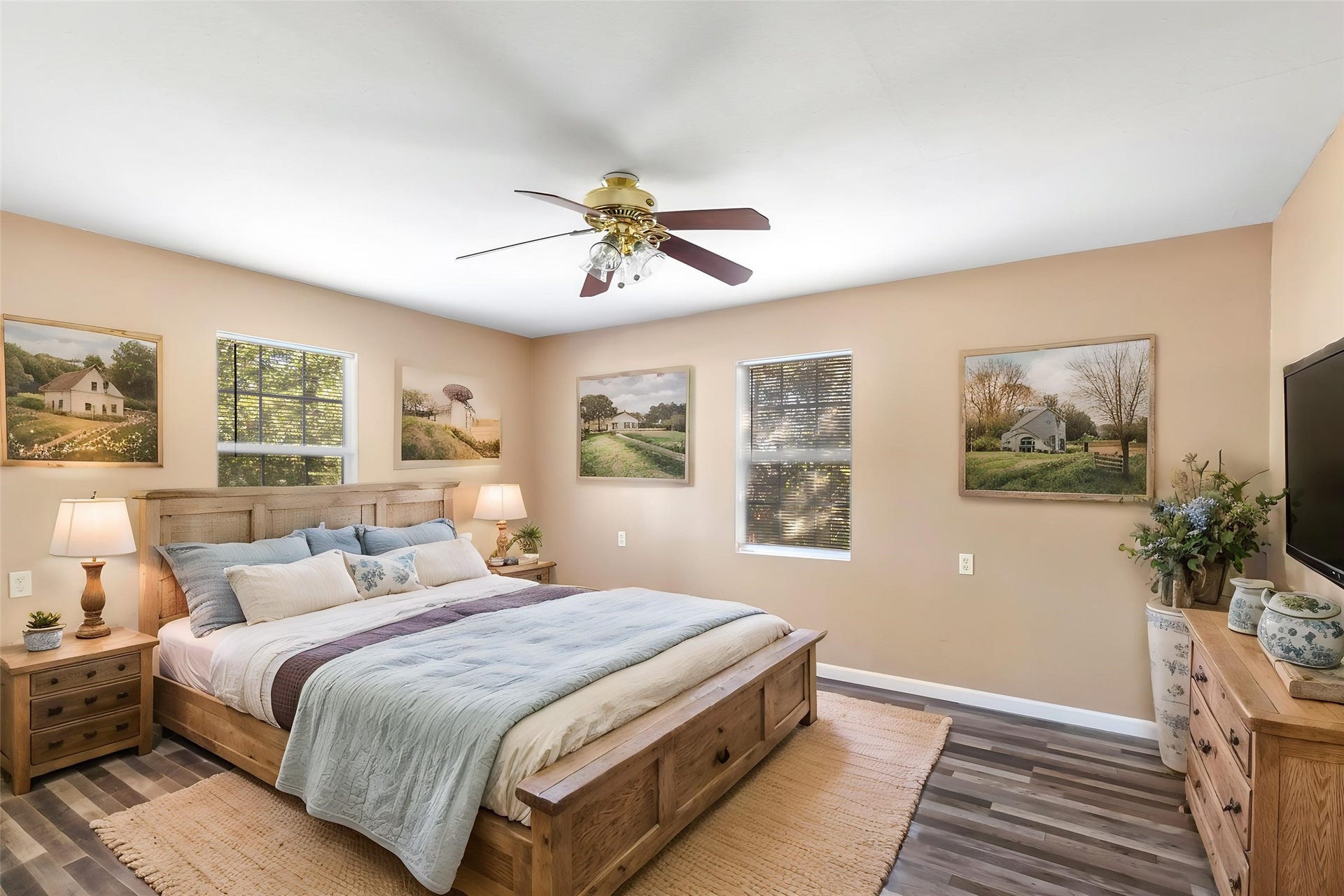 23304 E Community Drive, New Caney, TX 77357 Primary bedroom features a walk-in closet, natural light and a ceiling fan. (This photo is virtually staged.)