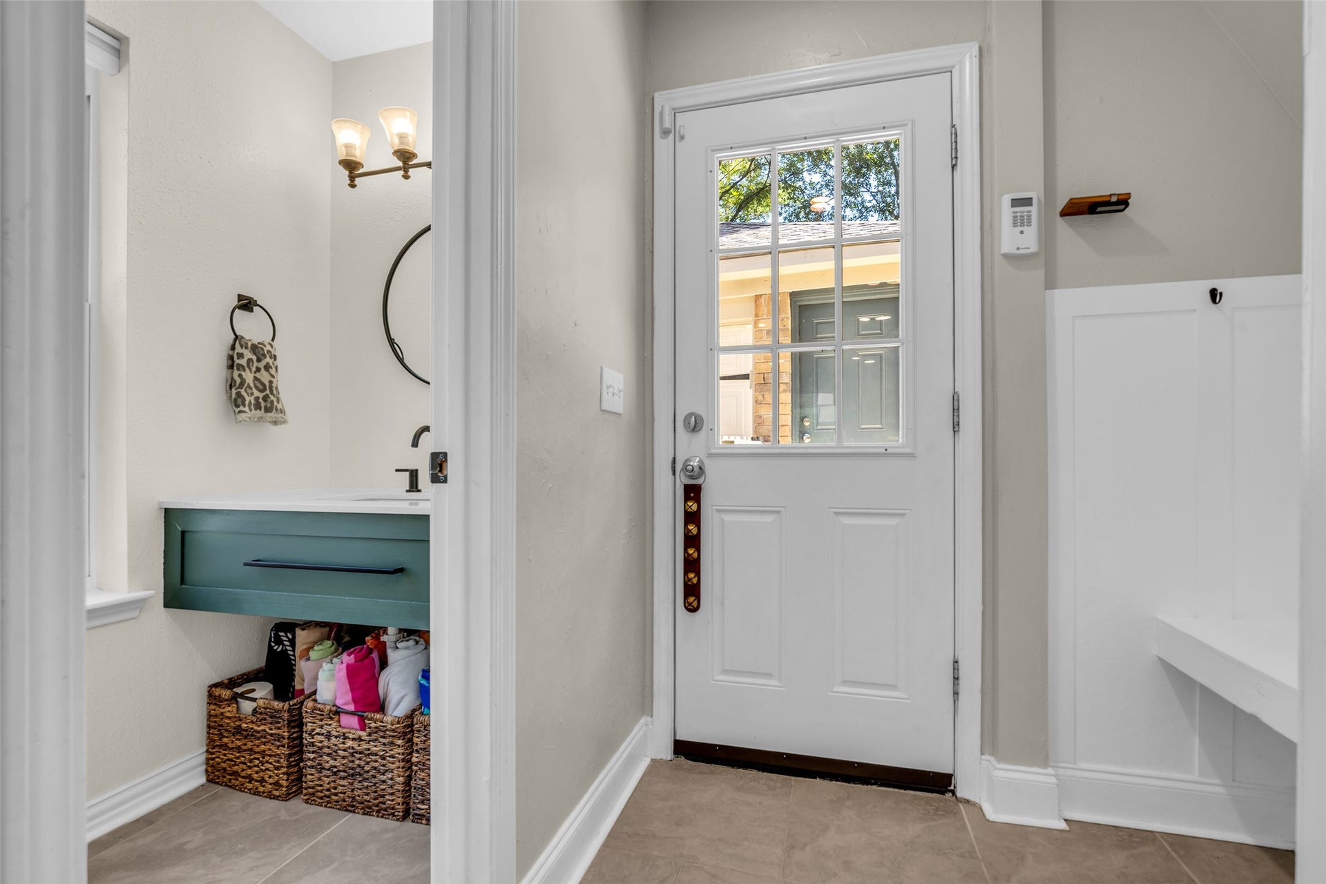 2 Tall Sky Place, The Woodlands, TX 77381 Half bath near laundry, mud room, and back door to detached garage