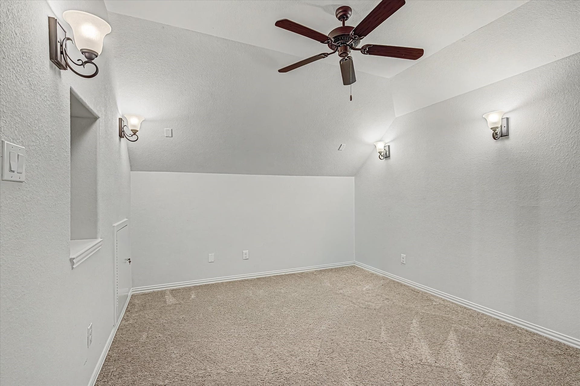 20302 Bandera Lake Lane, Richmond, TX 77407 Media room with soft carpet flooring, elegant wall sconces, and a ceiling fan.