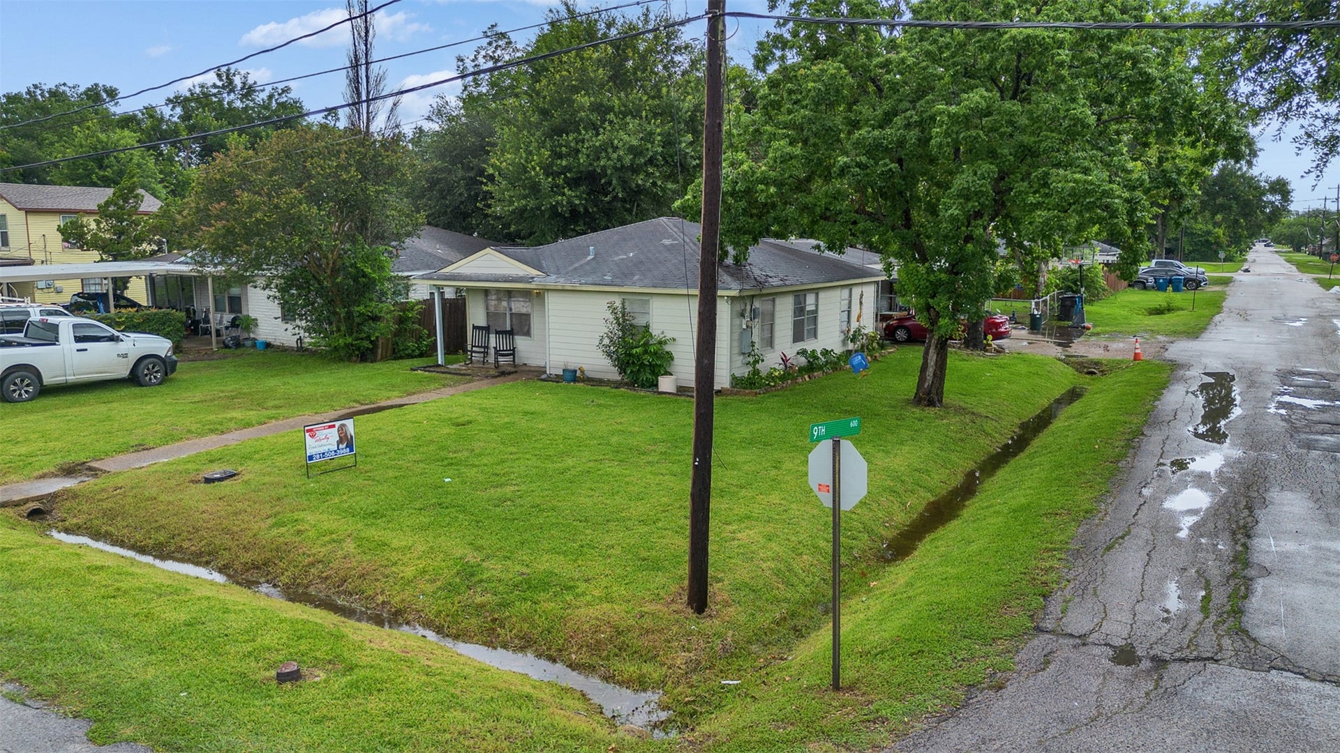 815 Avenue G, South Houston, TX 77587 This full exterior view showcases the home's low-maintenance front yard and oversized side driveway, offering plenty of parking and room for your hobbies, toys, or future plans. Practical, spacious, and full of potential!