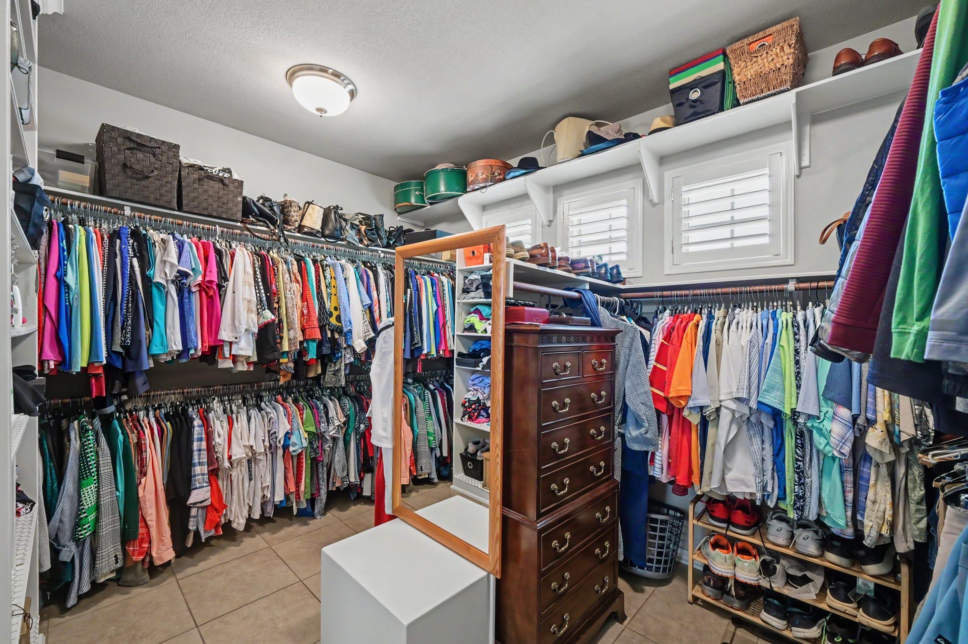 124 Wycliffe Drive, Montgomery, TX 77356 Exceptional walk-in closet with abundant hanging space and custom storage.