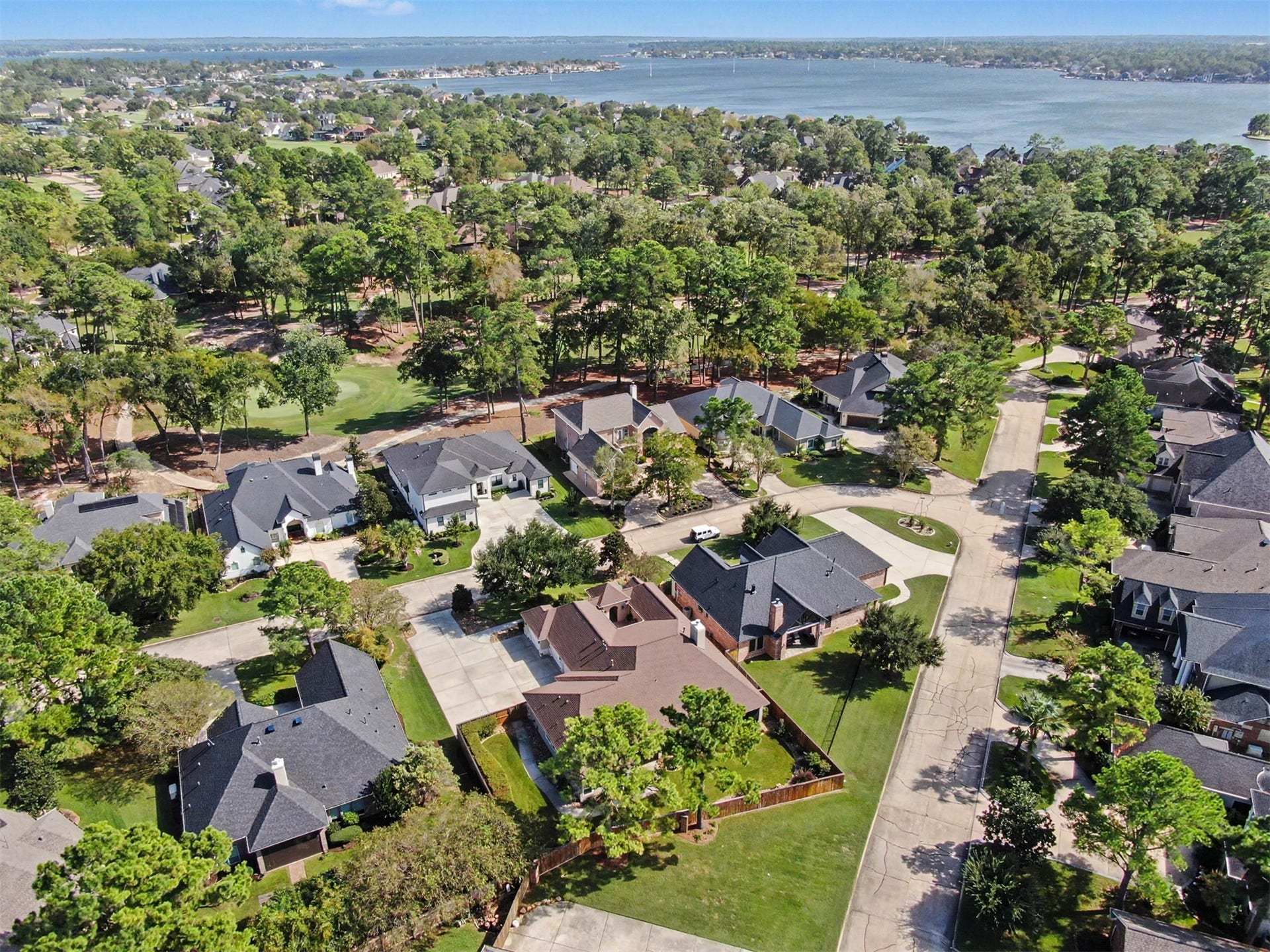 124 Wycliffe Drive, Montgomery, TX 77356 Picturesque aerial view of Bentwater's beautiful neighborhood with Lake Conroe beyond.