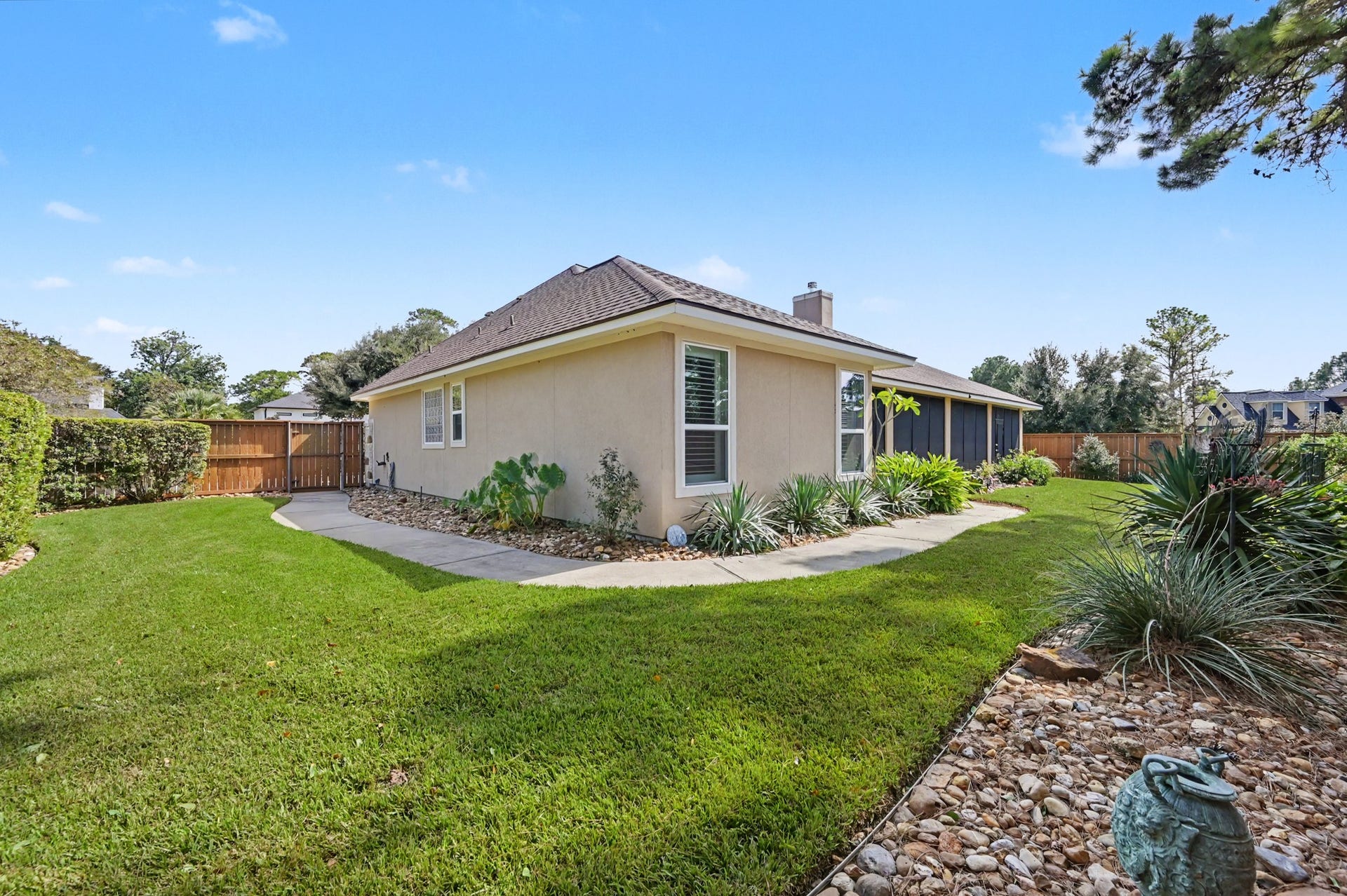 124 Wycliffe Drive, Montgomery, TX 77356 Gorgeous backyard retreat with mature trees and thoughtfully designed landscaping.