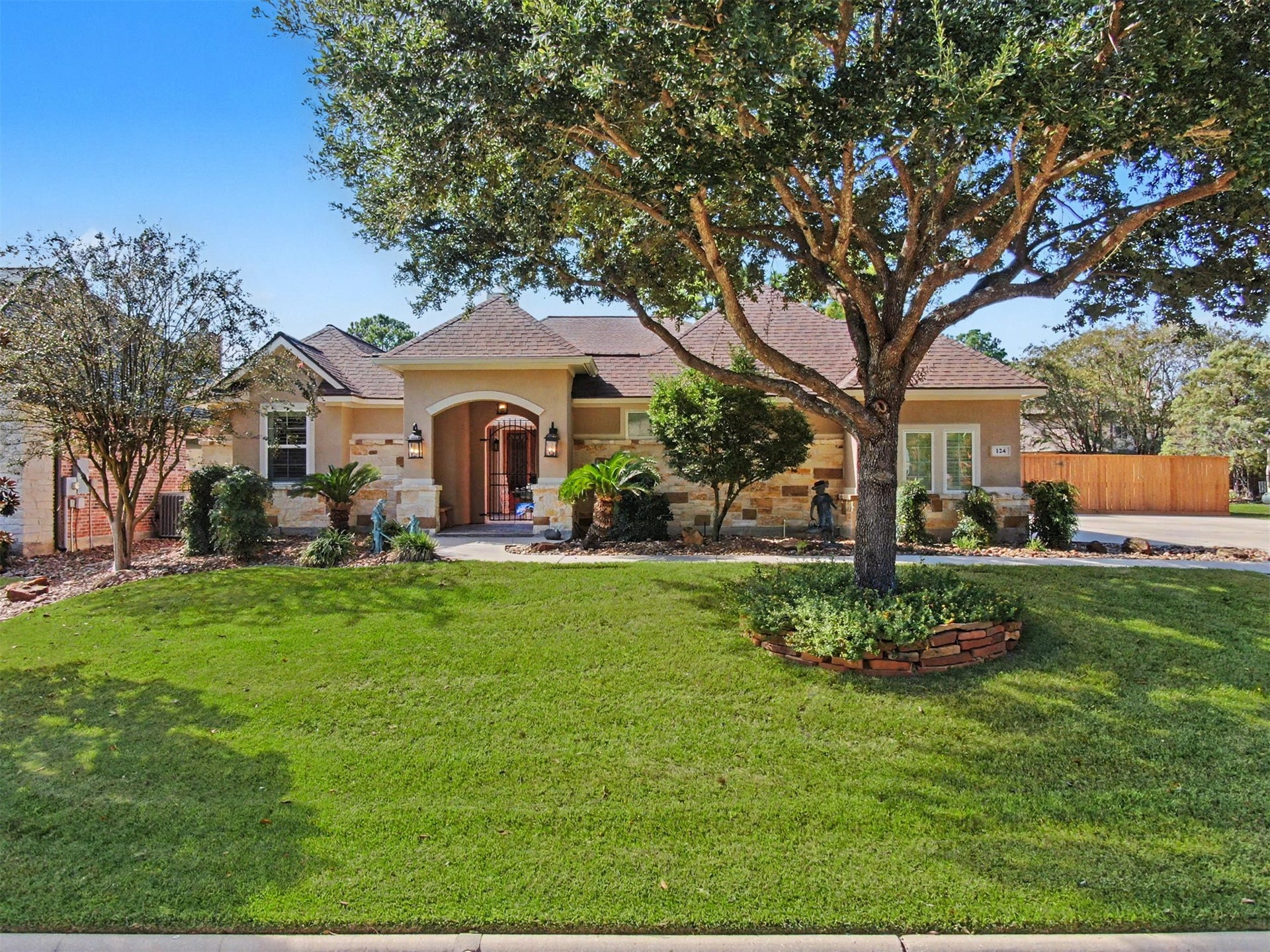 124 Wycliffe Drive, Montgomery, TX 77356 Impressive curb appeal with timeless architecture and attractive landscaping.