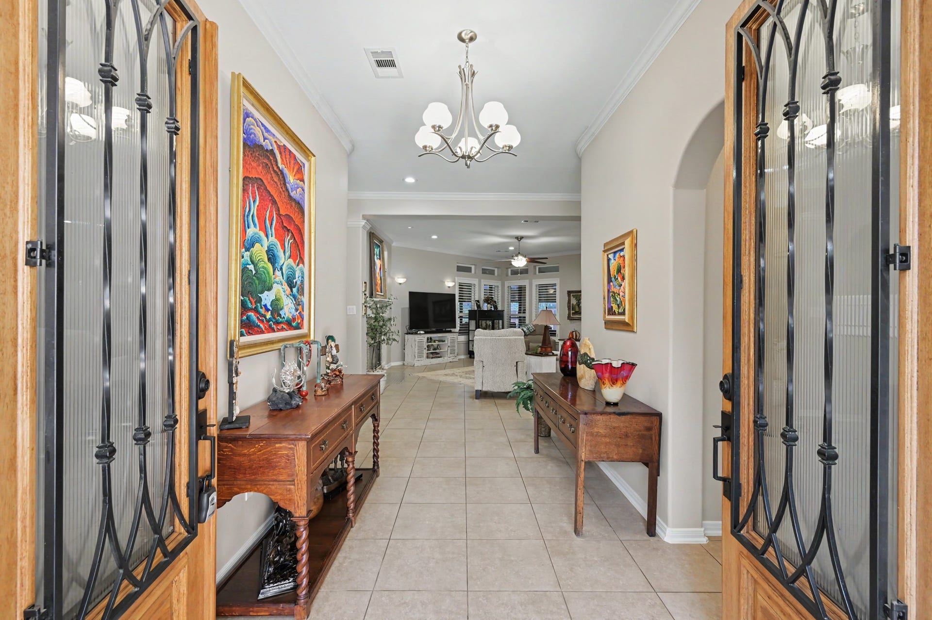 124 Wycliffe Drive, Montgomery, TX 77356 Gracious entry foyer with decorative iron doors and an inviting open layout.