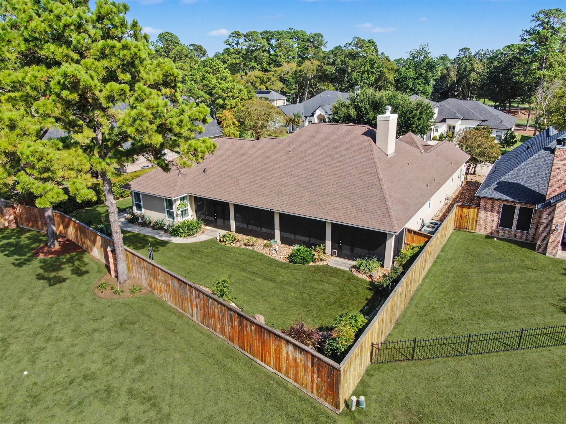 124 Wycliffe Drive, Montgomery, TX 77356 Spectacular aerial perspective of the expansive screened porch and private backyard.
