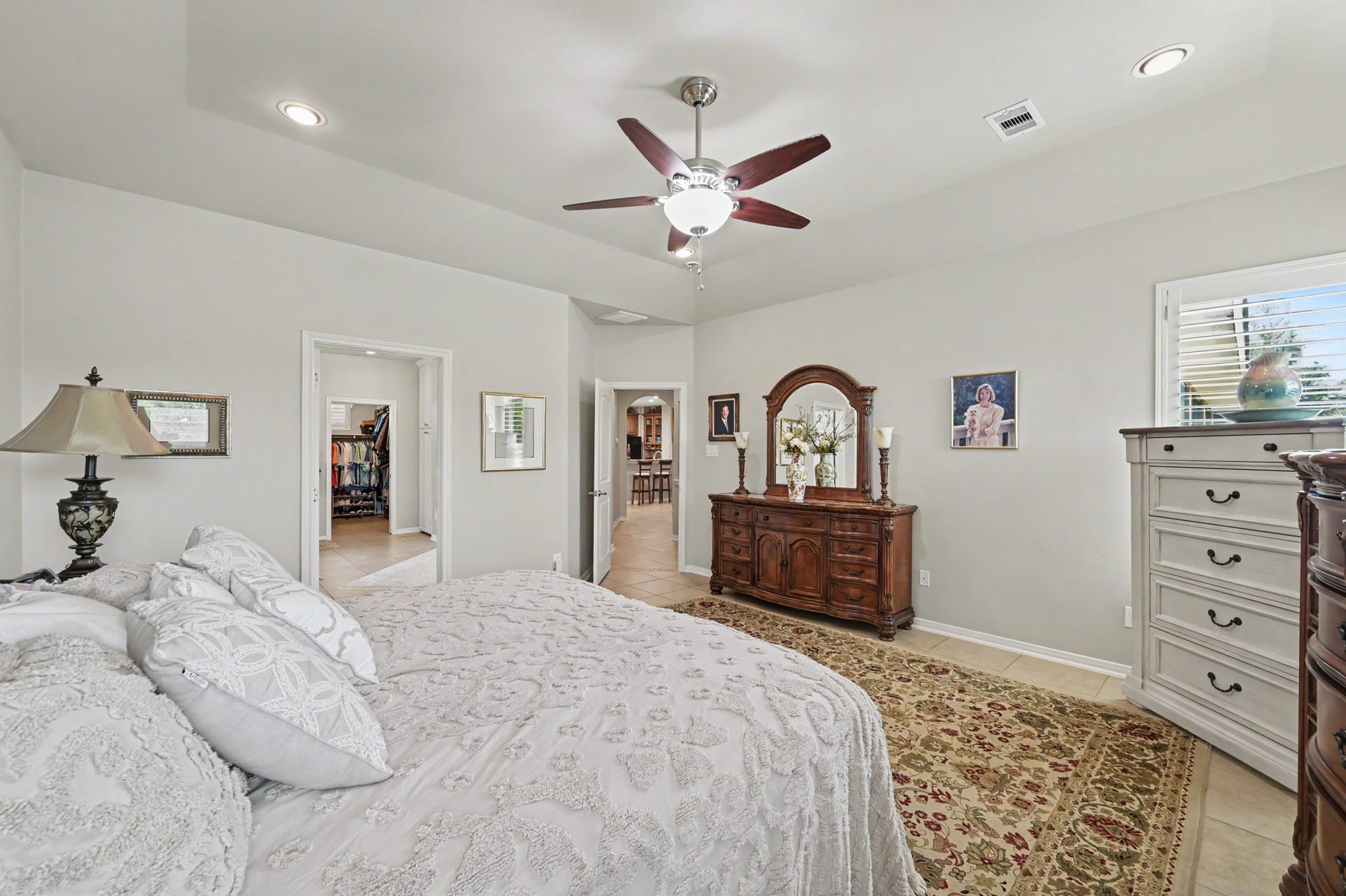 124 Wycliffe Drive, Montgomery, TX 77356 Generously sized primary suite with tray ceiling and timeless architectural details.