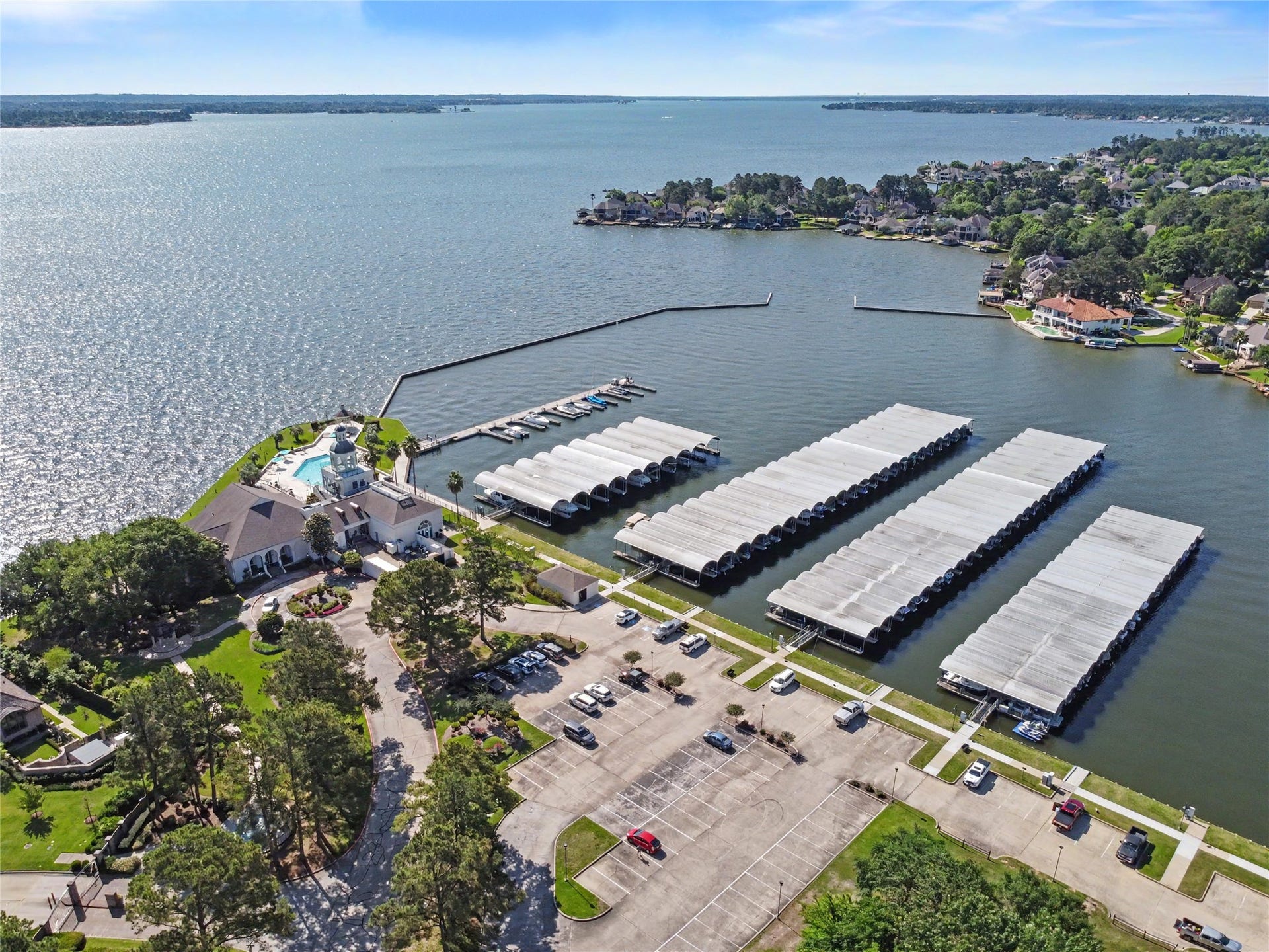 124 Wycliffe Drive, Montgomery, TX 77356 Expansive covered boat slips along the beautiful Lake Conroe shoreline.