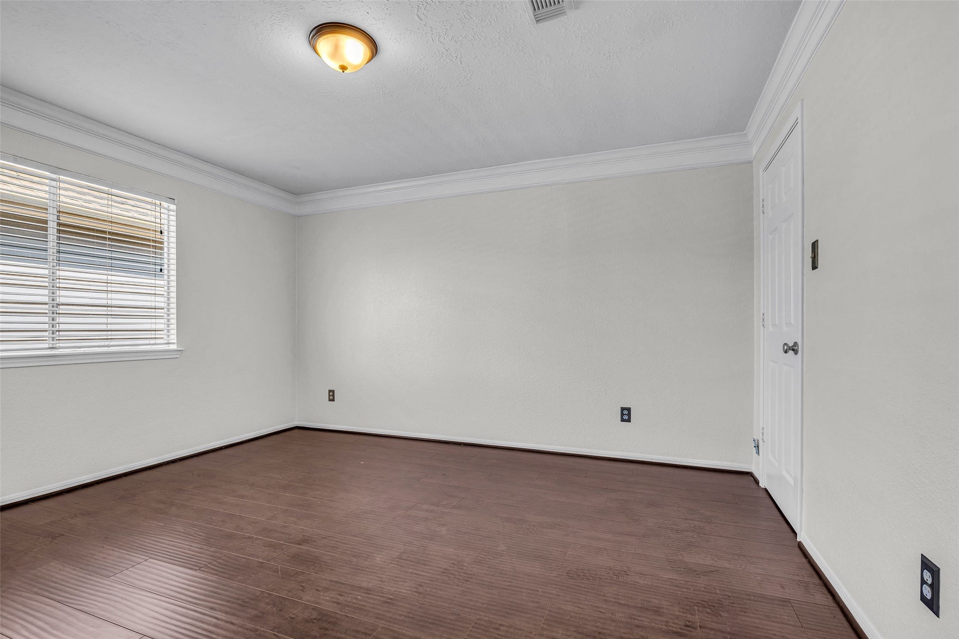 Another flexible bedroom with crown molding and plenty of space to make it your own.