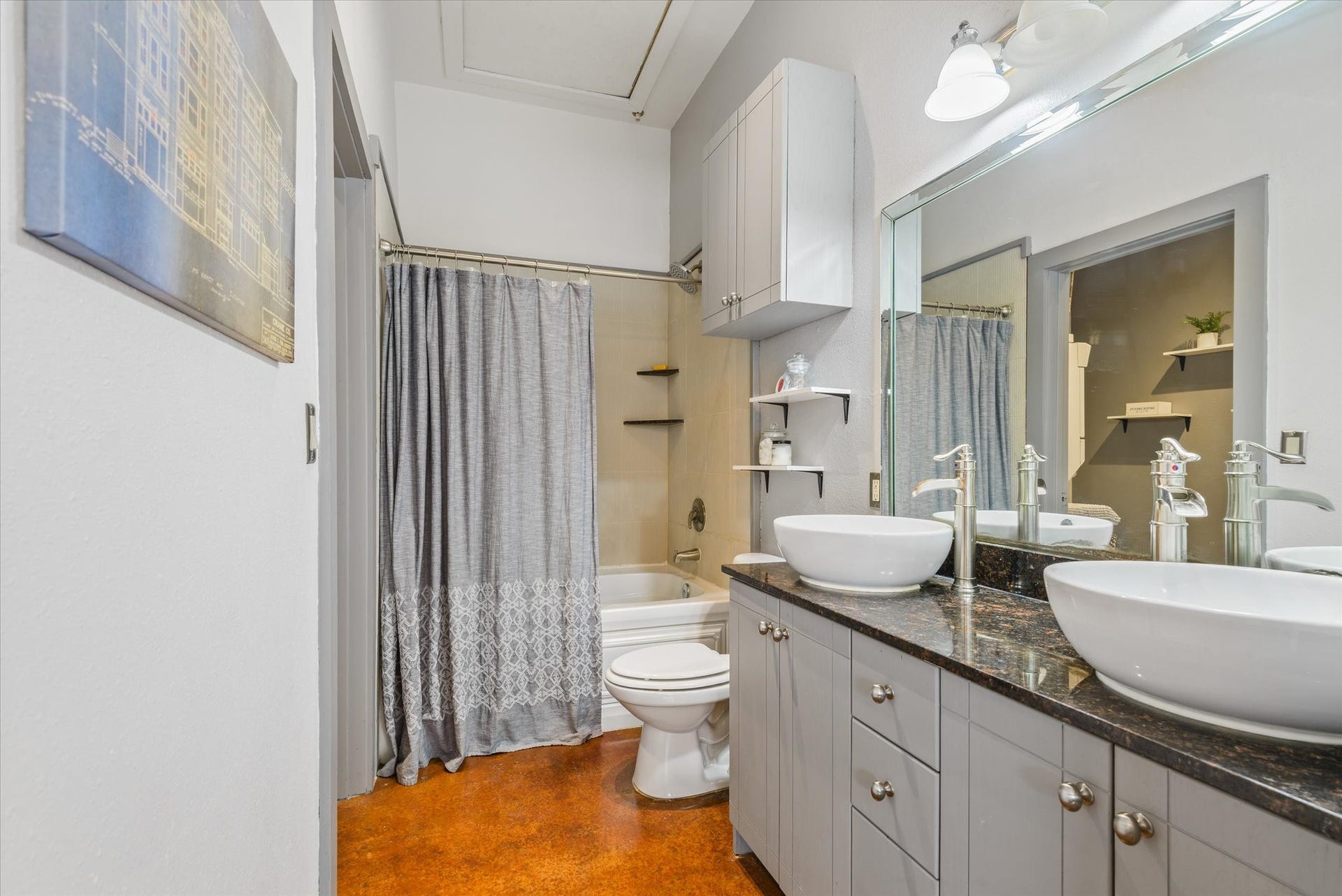 2205 Mckinney Street, #309, Houston, TX 77003 The flooring is consistent throughout the unit. The double sinks and large bathtub provide a spa style experience.