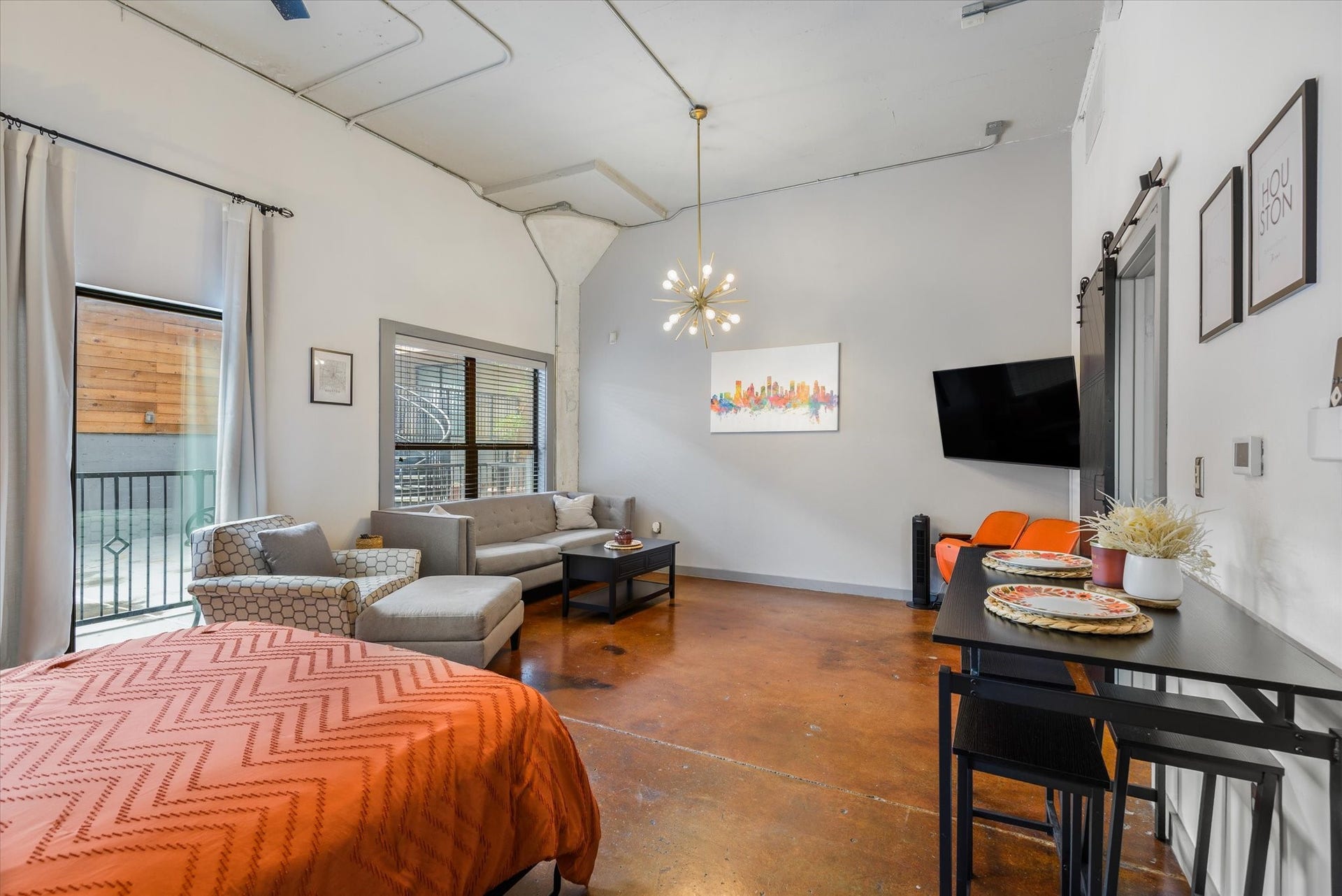 2205 Mckinney Street, #309, Houston, TX 77003 The condo is sold furnished including curtains, excluding stadium seating. The Murphy bed is a great flex piece.