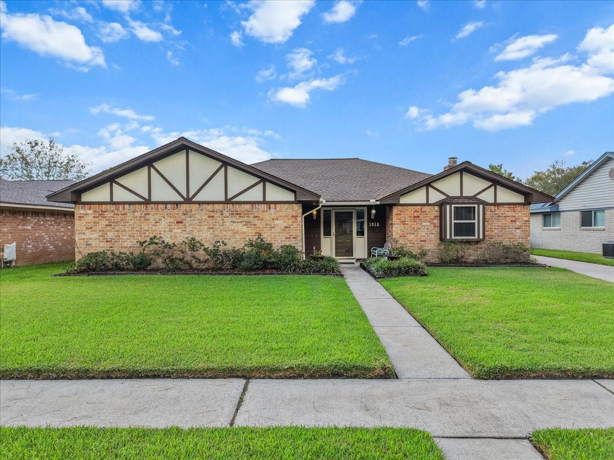 1918 Crooked Creek Lane, Pearland, TX 77581 Check out this classic brick ranch with charming Tudor-inspired details and curb appeal.