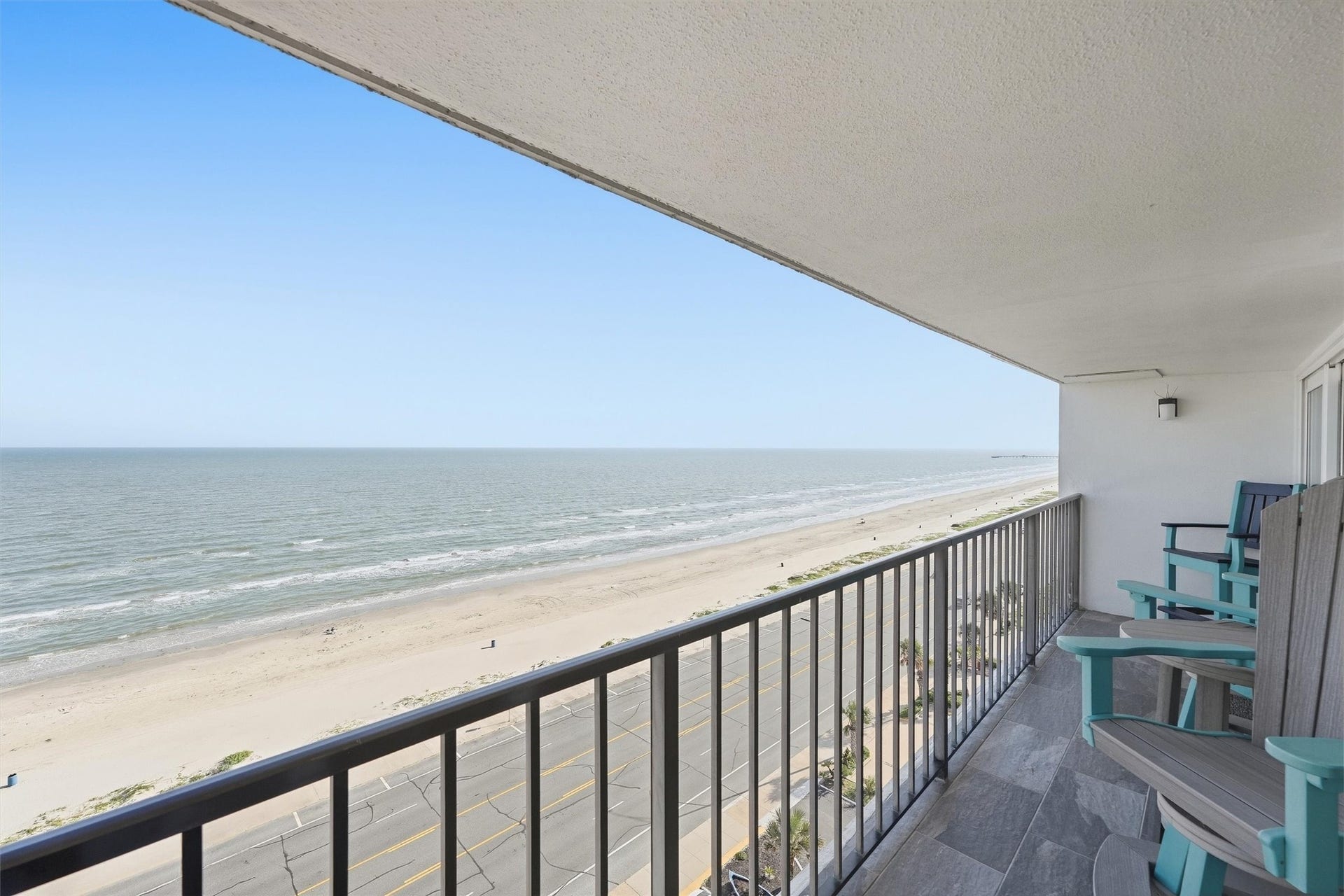 7310 Seawall Boulevard, #1105, Galveston, TX 77551 Experience breathtaking ocean views from this spacious balcony, perfect for relaxing and enjoying the serene beachfront setting.