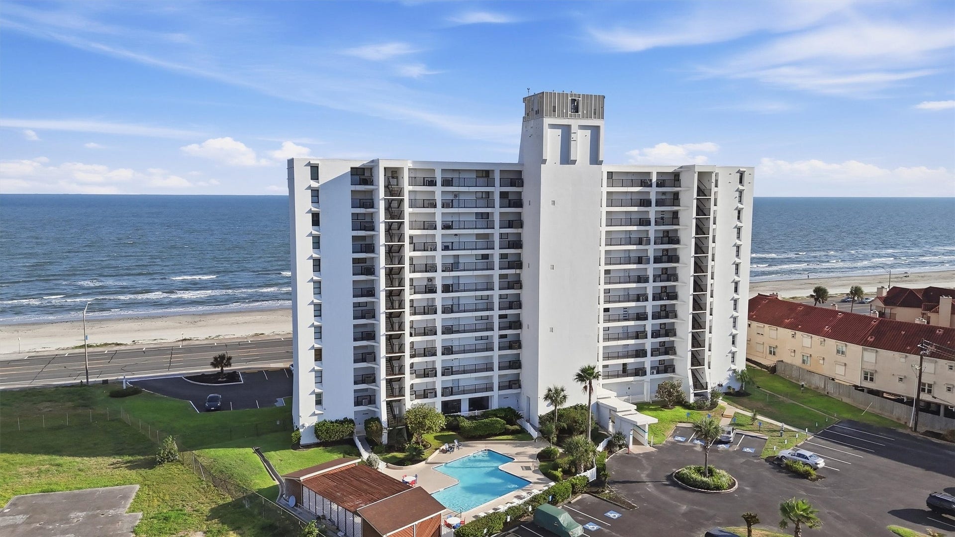 7310 Seawall Boulevard, #1105, Galveston, TX 77551 Discover coastal living in this modern beachfront condominium featuring stunning ocean views, a sparkling pool, and easy beach access. Perfect for those seeking a serene seaside retreat.