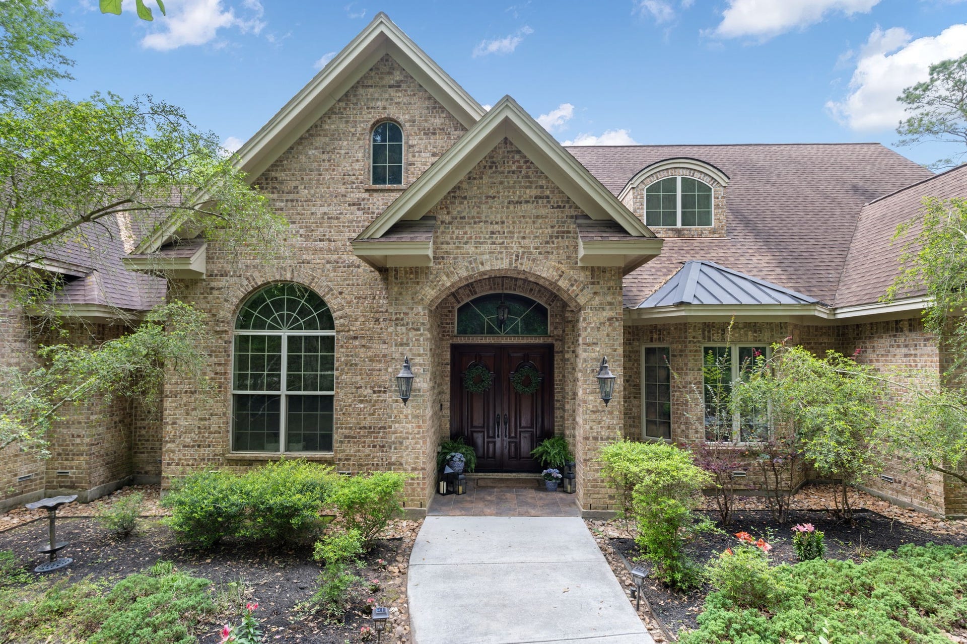 7421 Enchanted Stream Drive, Conroe, TX 77304 This land was once a nursery so there are an abundance of fruit trees; Peach, passion fruit, Olive, Pomegranite, fig, blackberries, and more.
