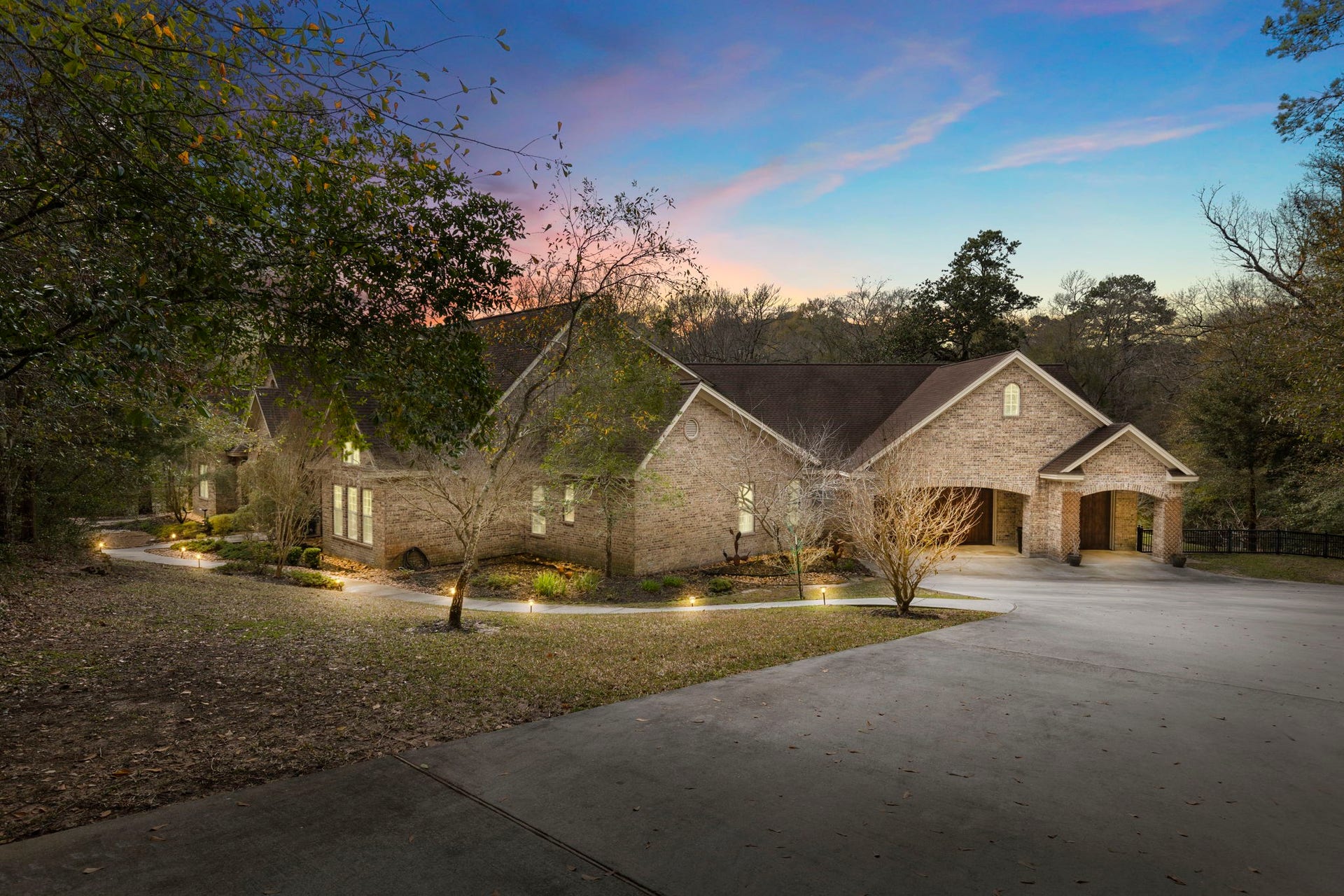 7421 Enchanted Stream Drive, Conroe, TX 77304 Sprawling 1-story, 4-sided brick beauty on over an acre of wooded bliss custom built by renowned builder and local celebrity Tom Tynan.