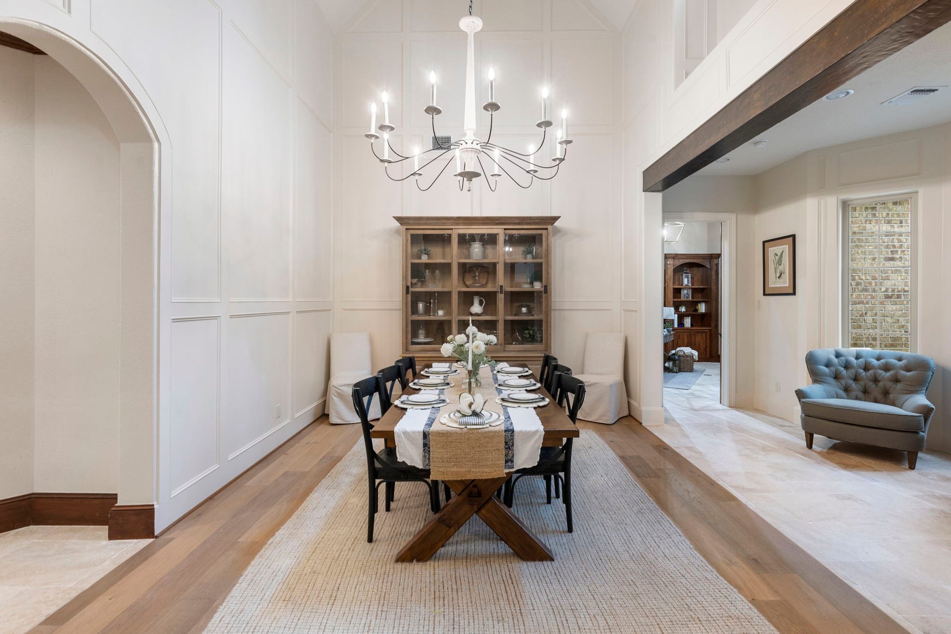 7421 Enchanted Stream Drive, Conroe, TX 77304 Magazine-worthy formal dining room with box molding, high arched ceilings, designer chandelier and easy kitchen access from the butlers pantry. The original owners created this space to accommodate two more dining tables comfortably during the holidays.