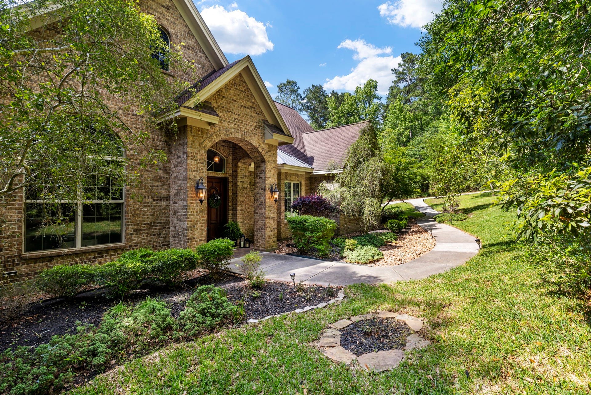 7421 Enchanted Stream Drive, Conroe, TX 77304 The front entry in super private from the street and truly magnificent.