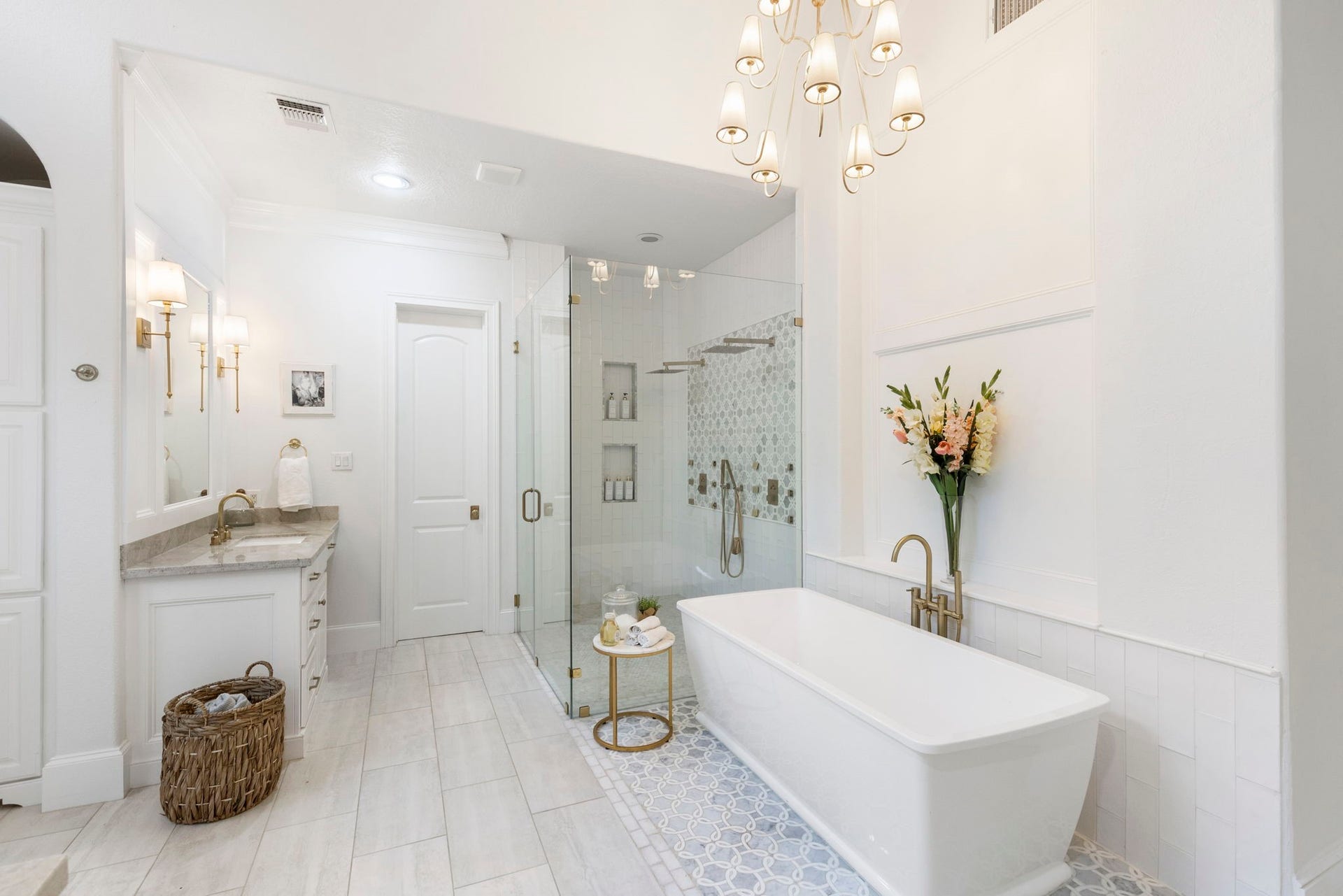 7421 Enchanted Stream Drive, Conroe, TX 77304 Breathtaking oversized, frameless, walk-in shower with marble, a two shower-head system, and double recessed shelving.