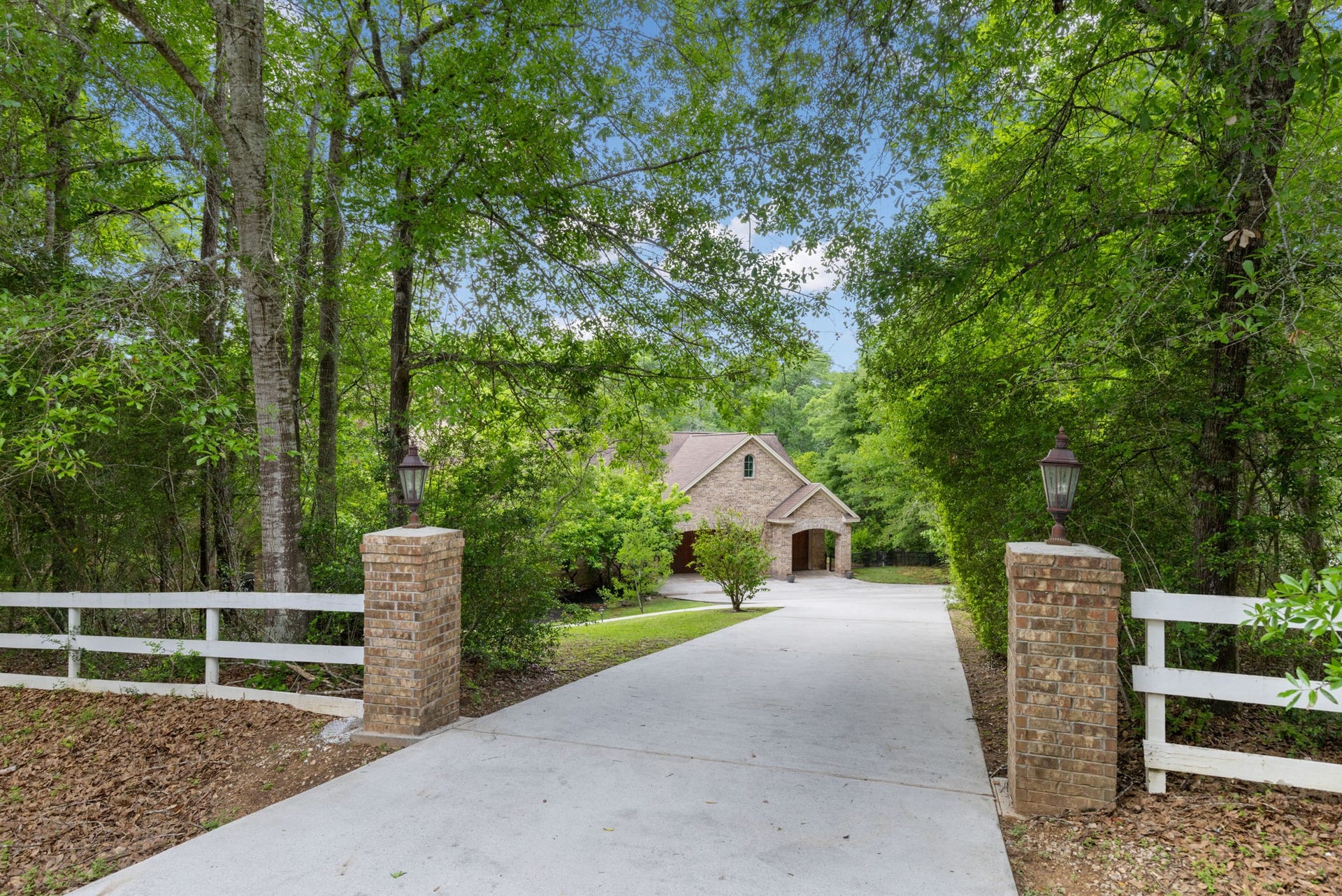 7421 Enchanted Stream Drive, Conroe, TX 77304 This property abounds with oak and magnolia trees plus fruit trees!