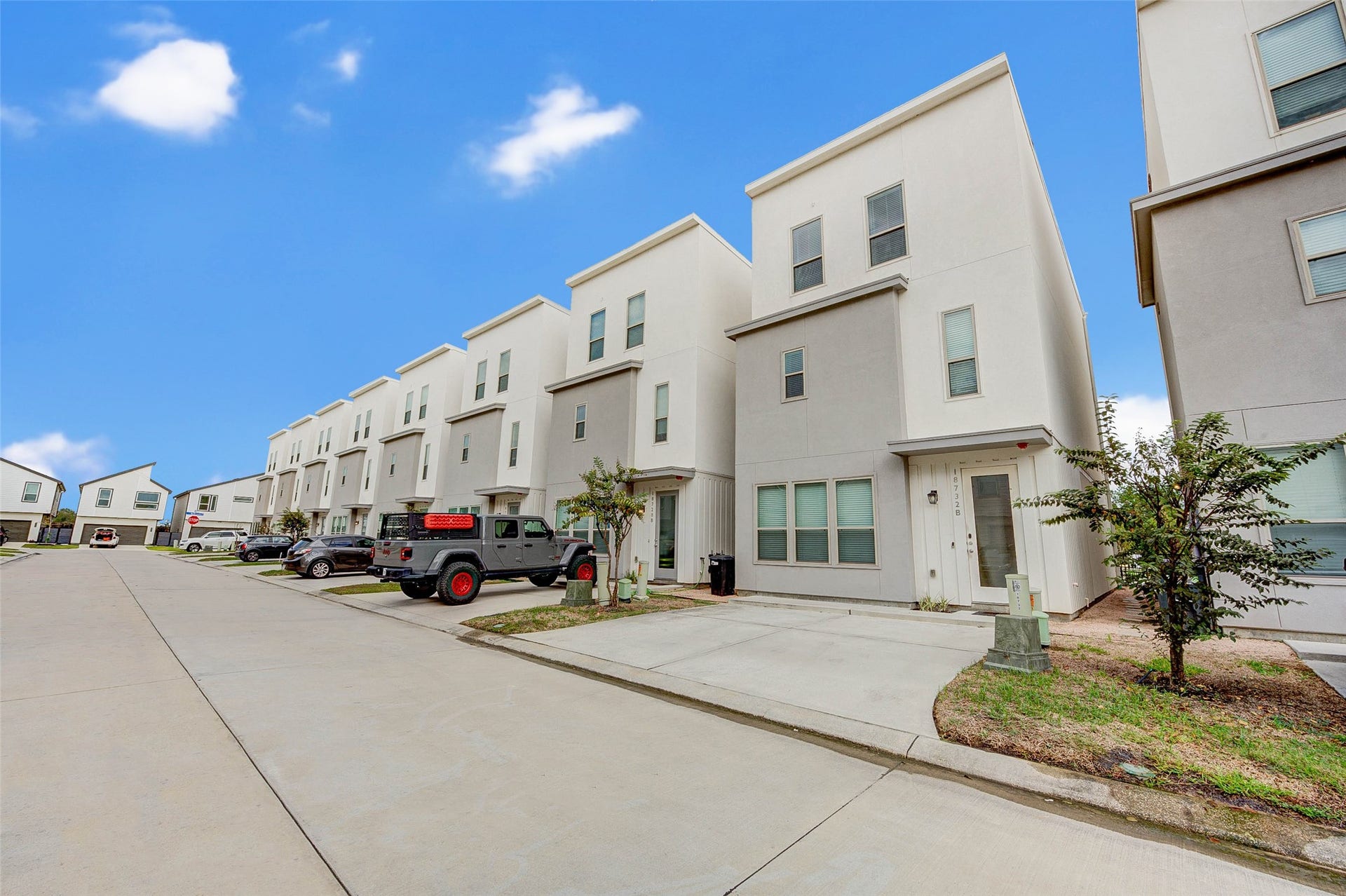 18732 Centro Main Street, Shenandoah, TX 77385 Discover modern living in this sleek townhouse featuring a convenient 2-car driveway, perfect for effortless urban lifestyle.