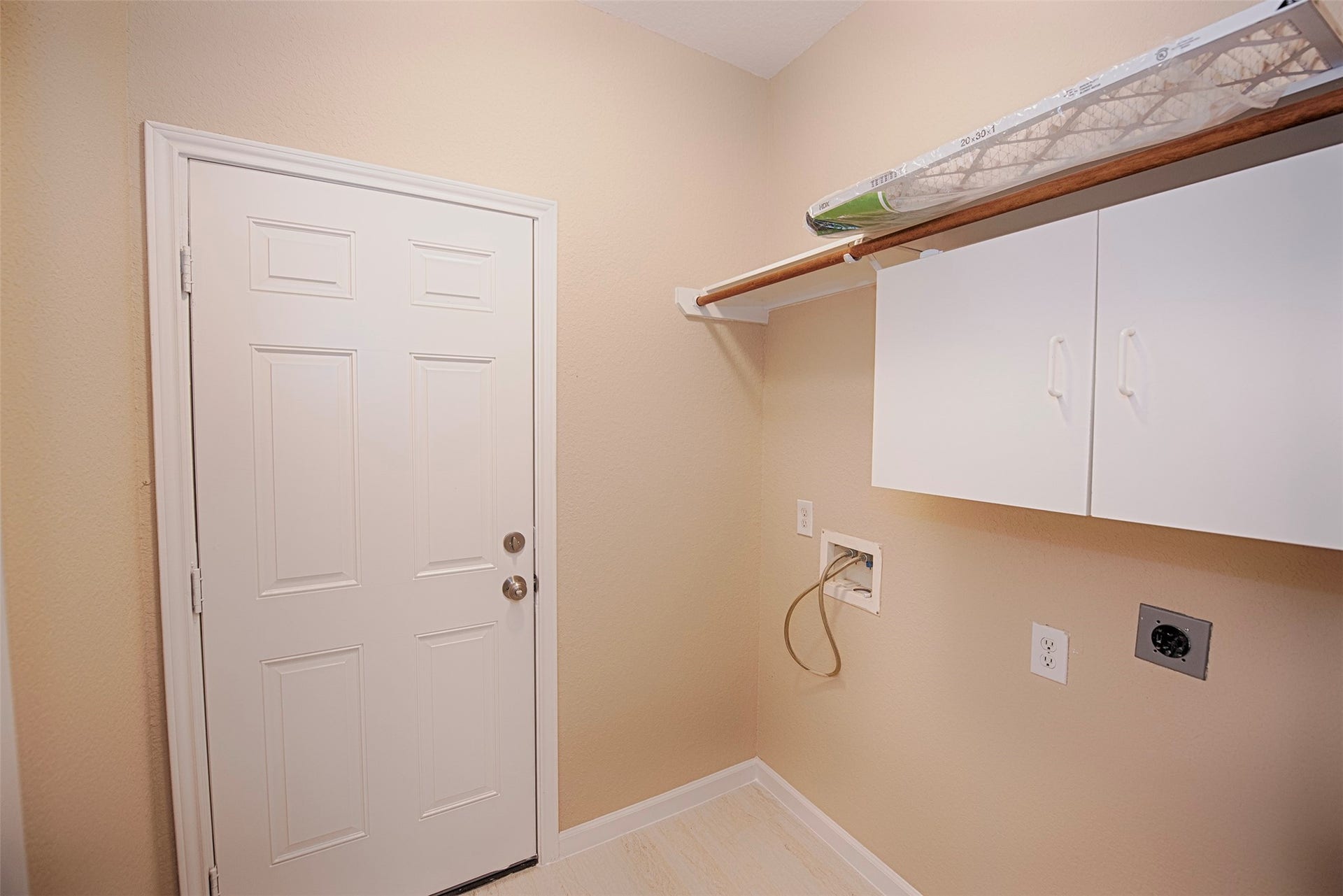 10411 Village Lake Drive, Missouri City, TX 77459 On your way to the garage is the utility room with built in cabinetry and space for your washer and dryer.