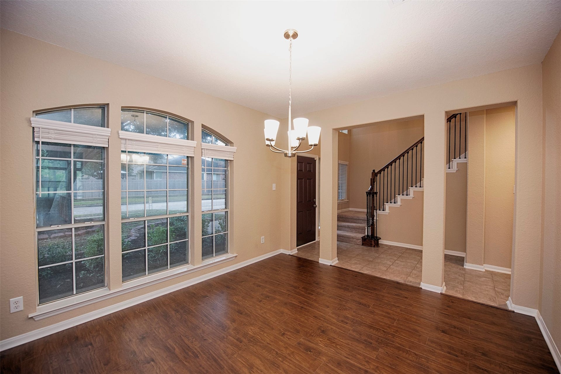 10411 Village Lake Drive, Missouri City, TX 77459 A view of the formal dining room open to the foyer. Amazing space for entertaining with friends and family with the upcoming holidays.