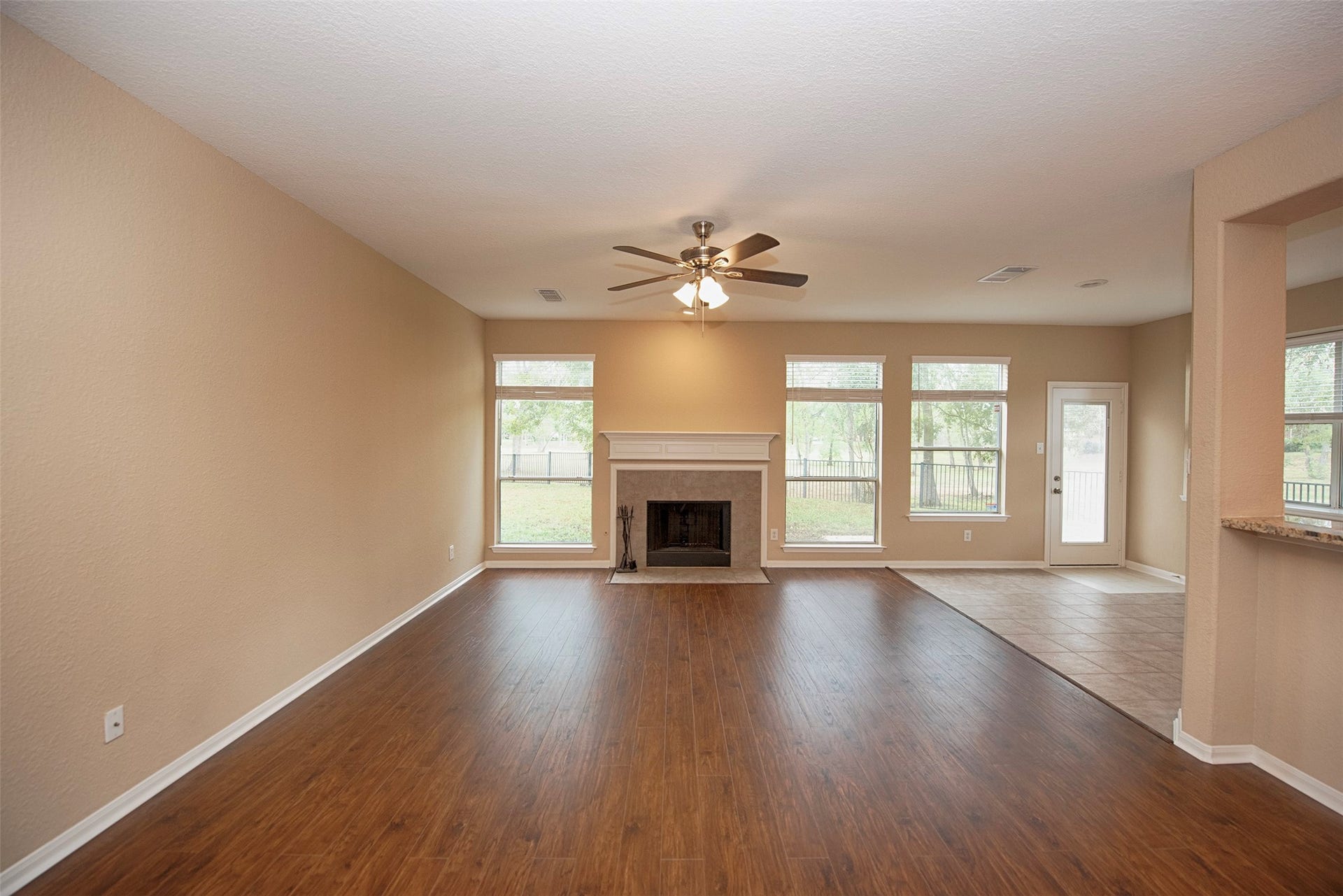 10411 Village Lake Drive, Missouri City, TX 77459 Gorgeous family room with the waterproof laminate floors and fabulous space. Views to the backyard and no back neighbors.