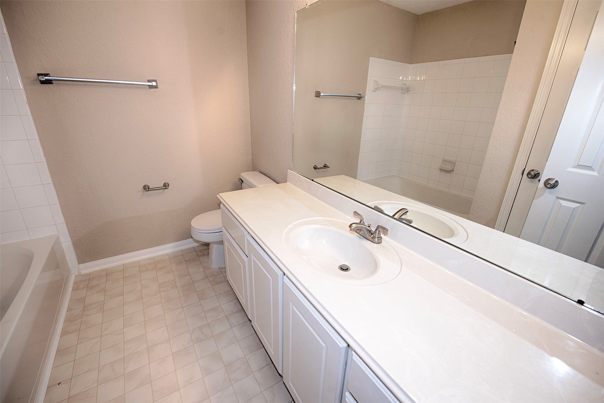 10411 Village Lake Drive, Missouri City, TX 77459 Additional upstairs bathroom with extra long vanity which is perfect for sharing.