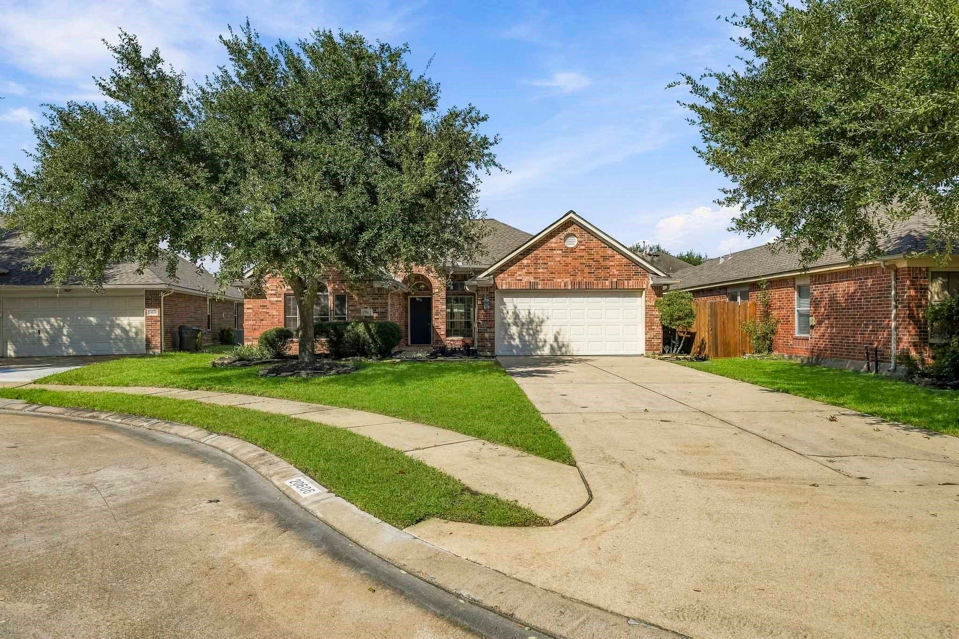 Grand, mature shade tree enhancing the curb appeal and providing natural canopy.