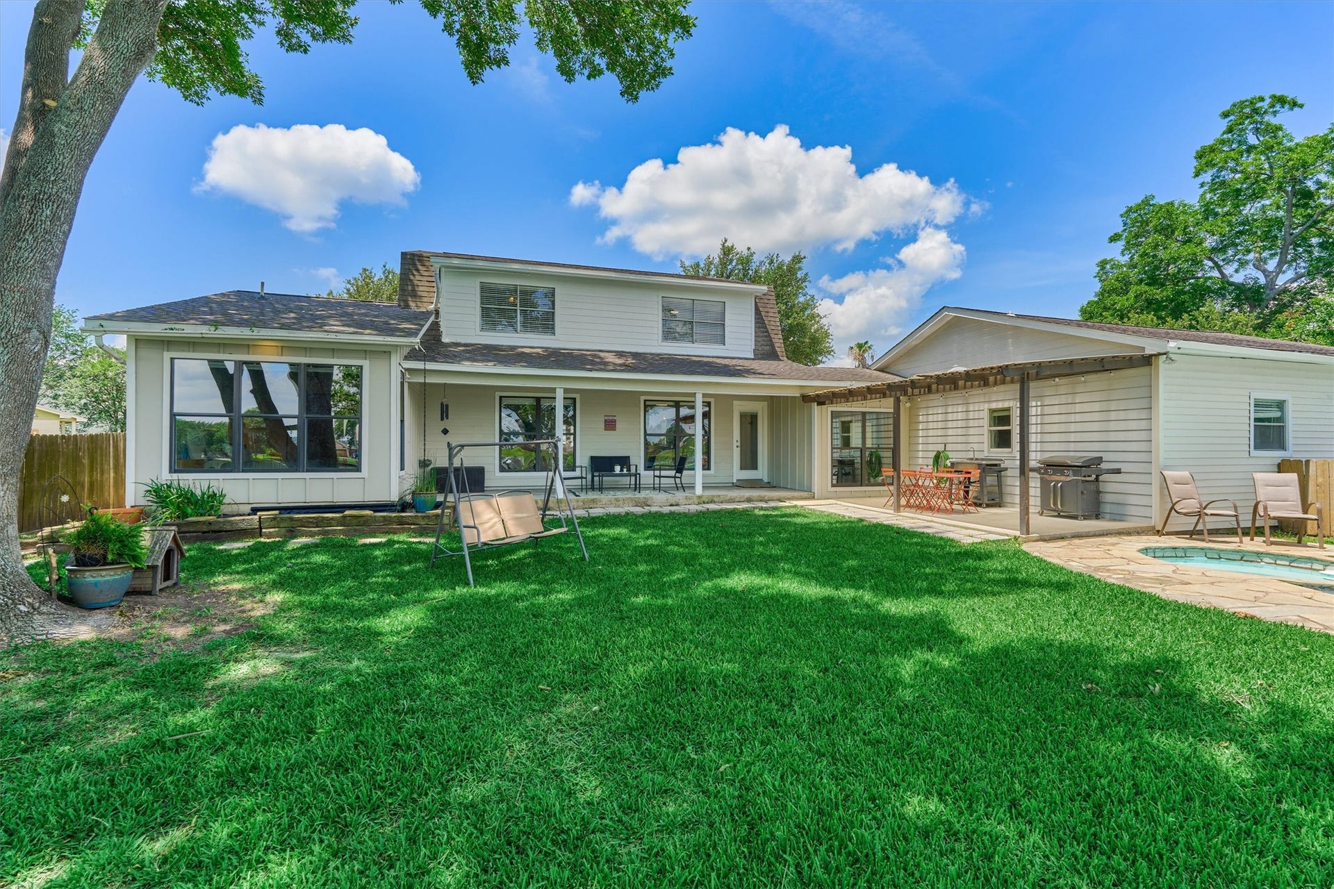438 Lazy Lane, Montgomery, TX 77356 Stepping back outside, the covered patio extends the home's living spaces.
