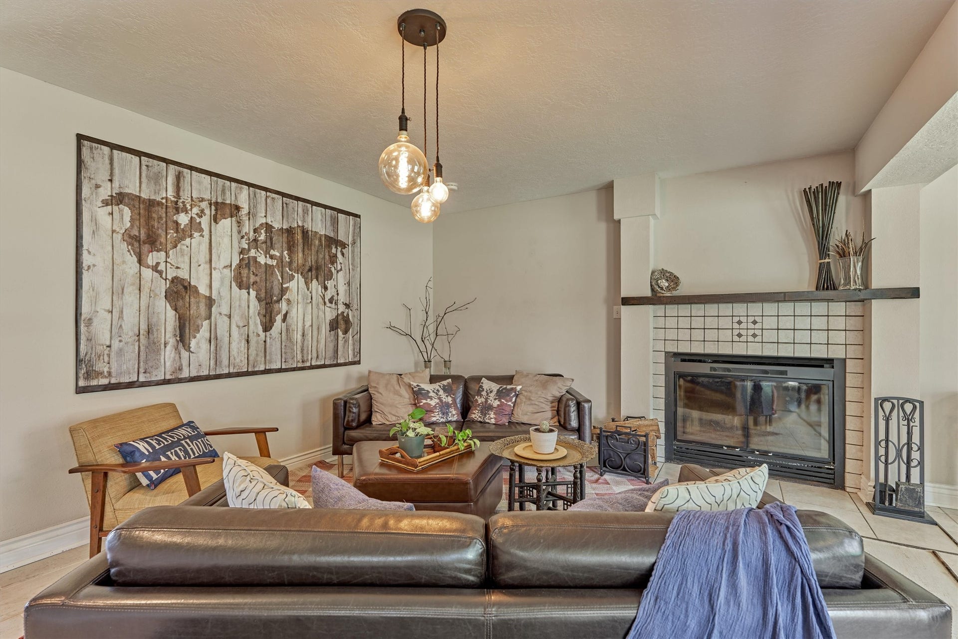 438 Lazy Lane, Montgomery, TX 77356 Anchored around the charming wood-burning fireplace, where a custom wood mantel and timeless finishes create the perfect setting for cozy evenings.