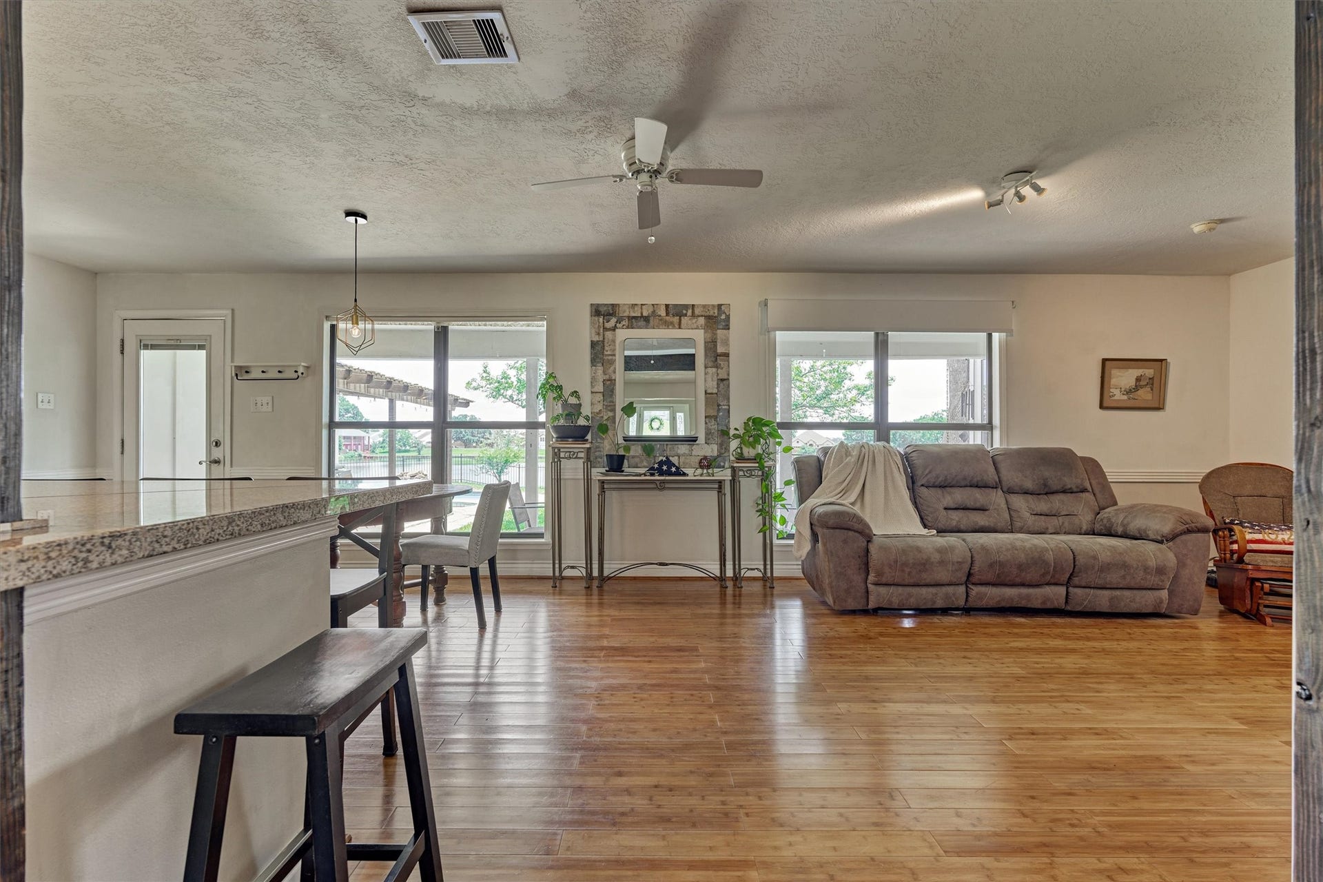 438 Lazy Lane, Montgomery, TX 77356 Moving further into the home, open living spaces create a comfortable flow ideal for everyday living. Large windows bring the beauty of the outdoors inside.