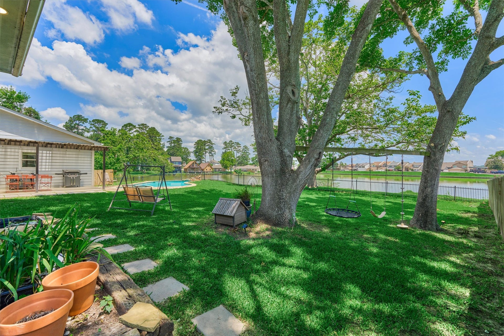 438 Lazy Lane, Montgomery, TX 77356 Wide open green space creates endless opportunities for outdoor entertaining, family gatherings, and peaceful afternoons by the water.