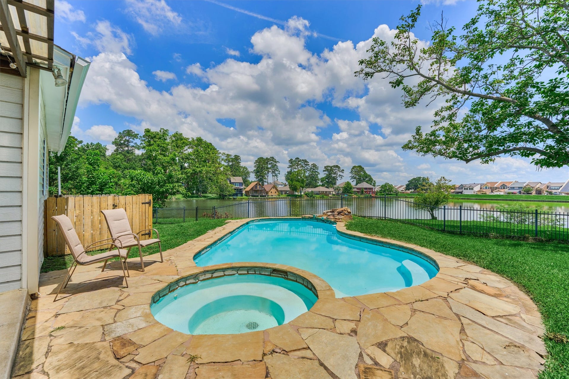 438 Lazy Lane, Montgomery, TX 77356 The pool, spa, mature trees, and expansive lawn come together to create an extraordinary waterfront outdoor experience.