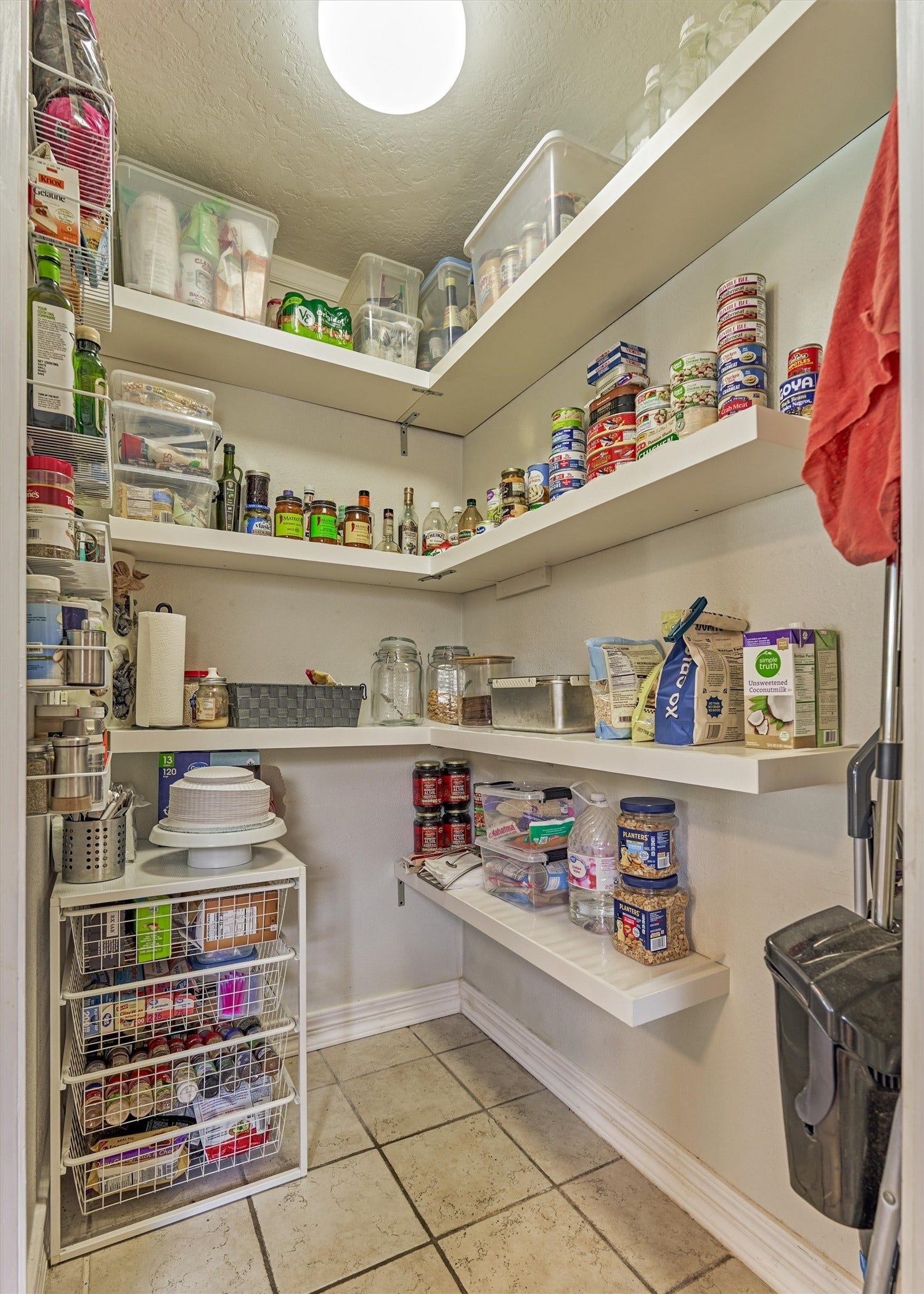 438 Lazy Lane, Montgomery, TX 77356 A large walk-in pantry offers exceptional organization and convenience.