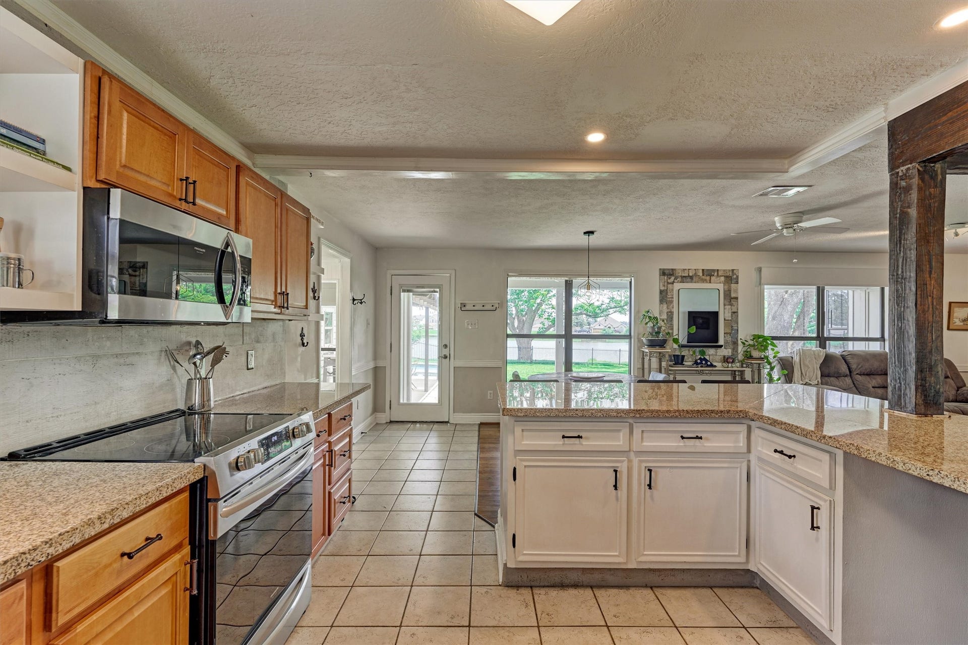 438 Lazy Lane, Montgomery, TX 77356 Take a closer look at the glass top stove and overhead built in microwave.