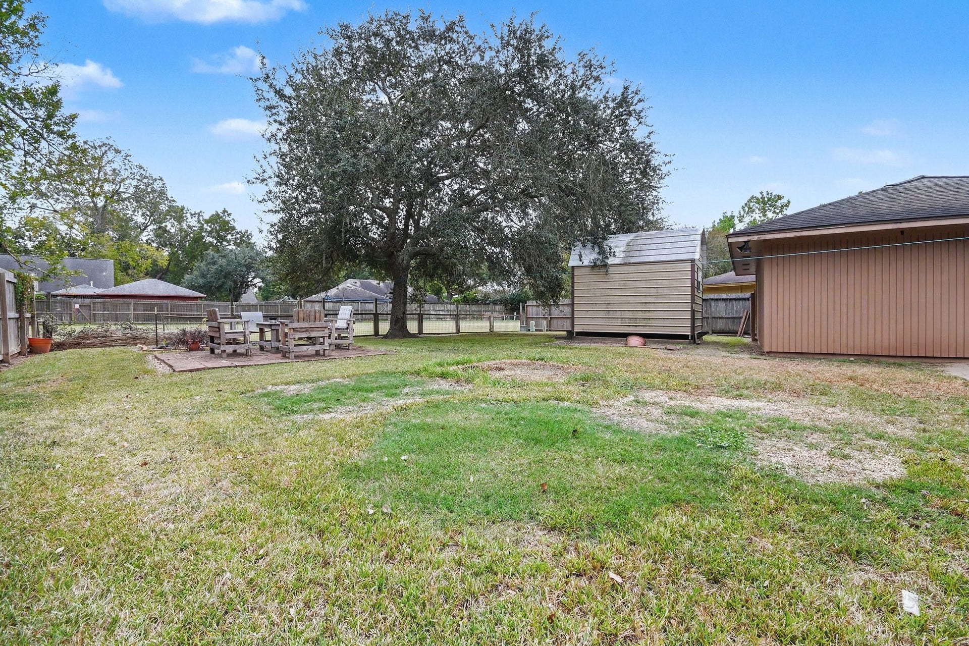Large back yard with green belt behind