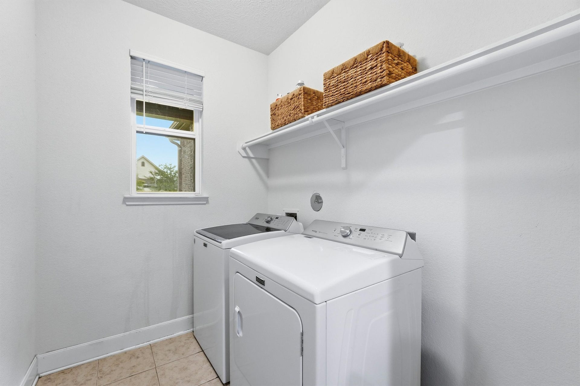 3502 Saxton Green Rd Road, Pearland, TX 77584 Convenient utility room with washer/dryer connections and overhead storage.