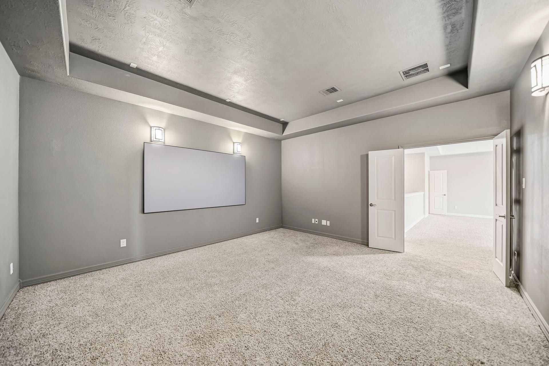Media room upstairs has French doors opened to the Game room. There is also a 1/2 bath located upstairs for guests convenience.