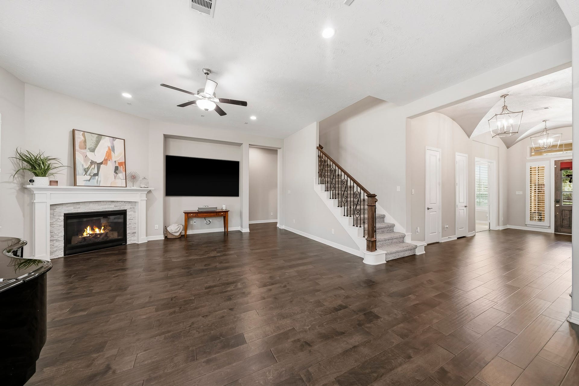 View of wrought iron stair parts to the game room and media room. Beautiful engineered hardwood floors