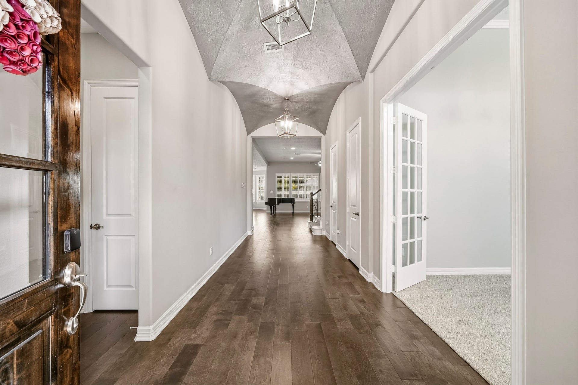 Look and these entry ceilings!!!! Engineered hardwood floors through the Entry and main living areas.