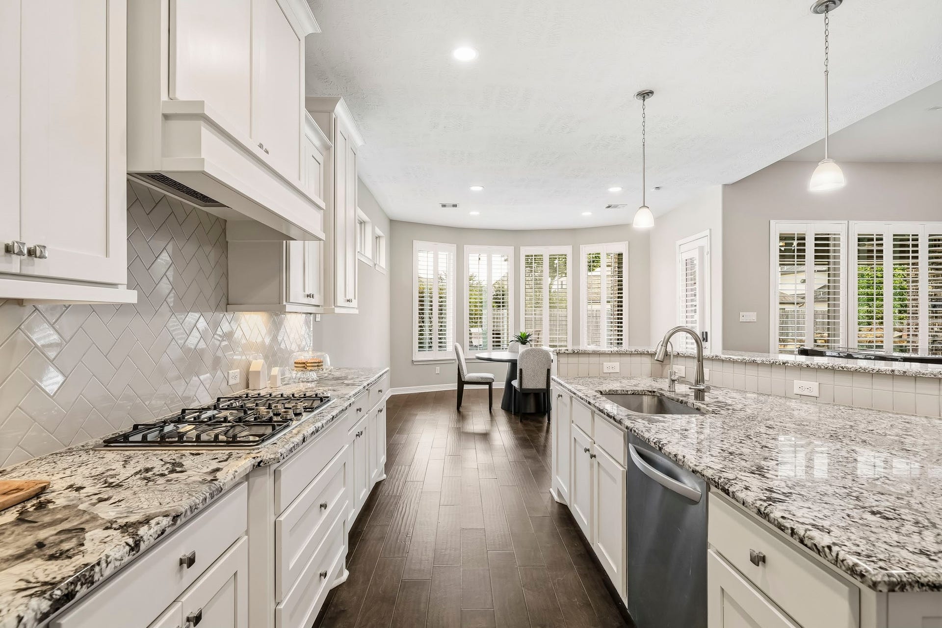 stainless appliances, gas cooktop, herringbone backsplash...