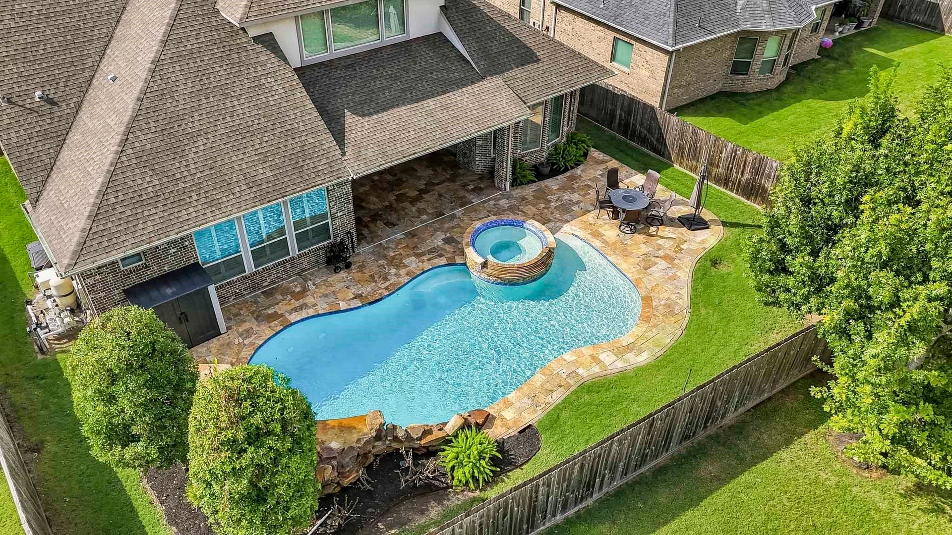 Look at this amazing pool and spa  with lots of patio area for entertaining. Water softener, Base generator available or can be removed.